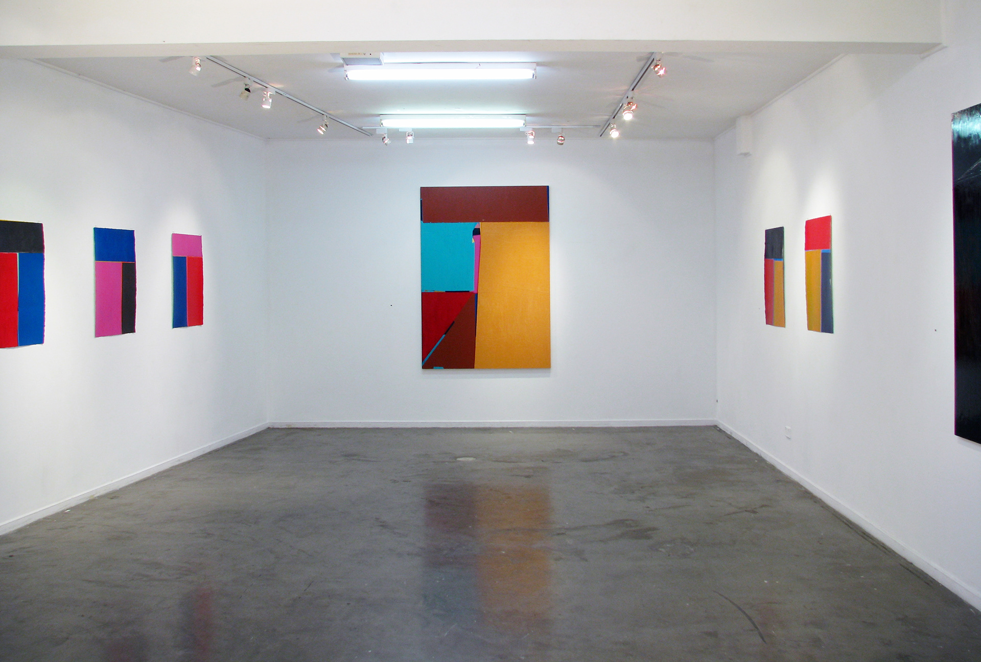 abstract paintings on a white wall