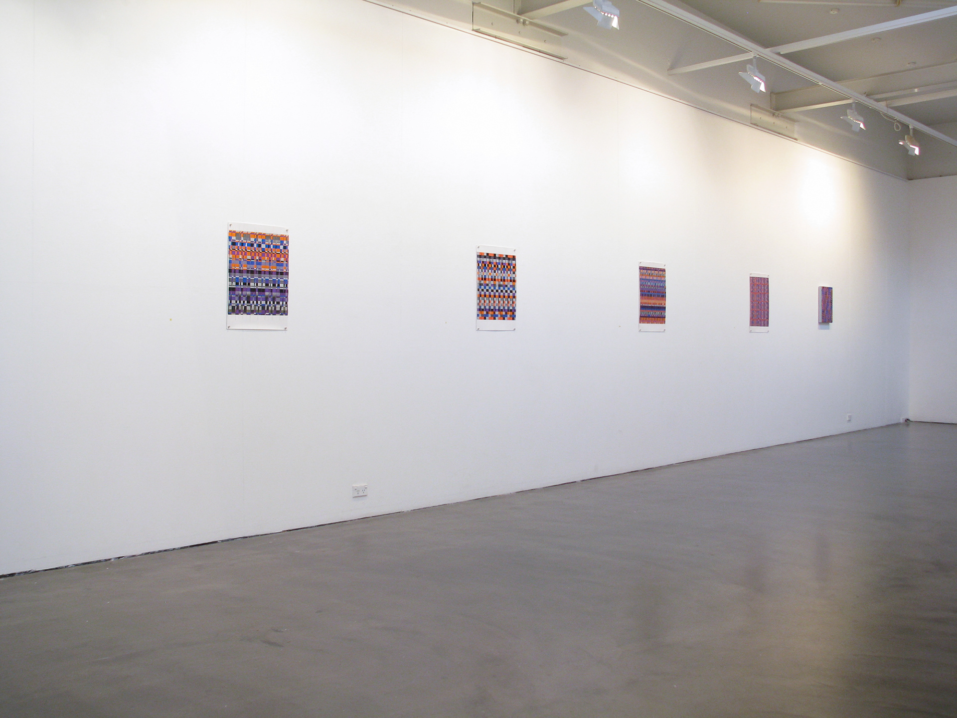 abstract paintings on a white wall