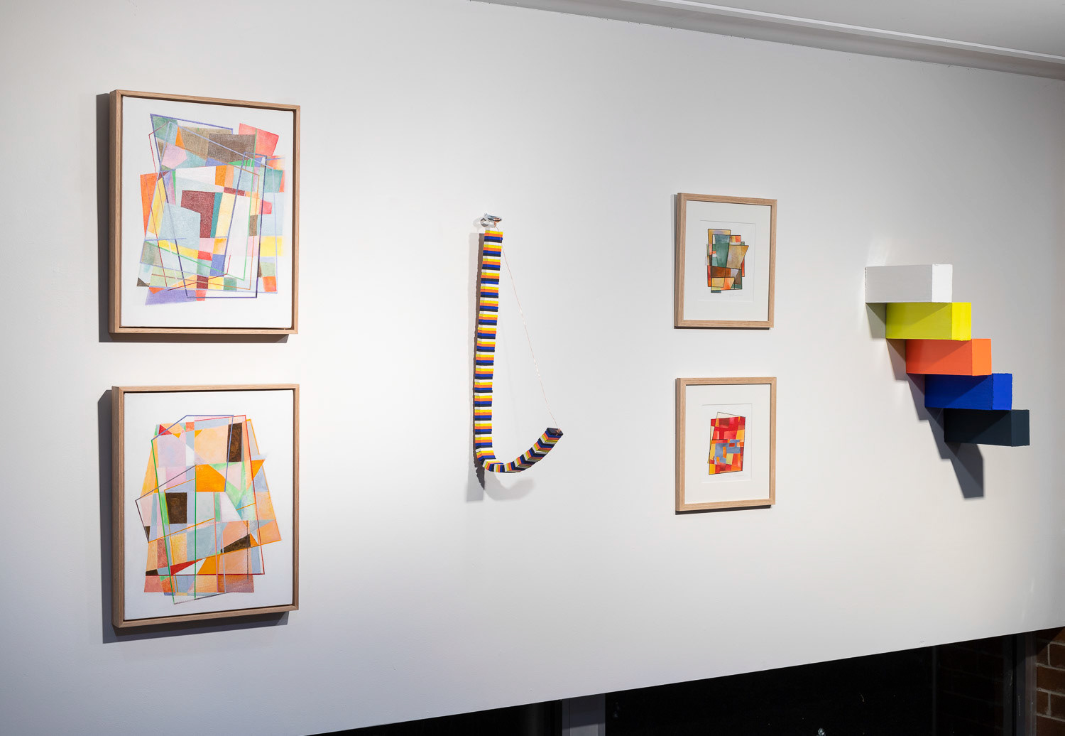 abstract paintings on a white wall