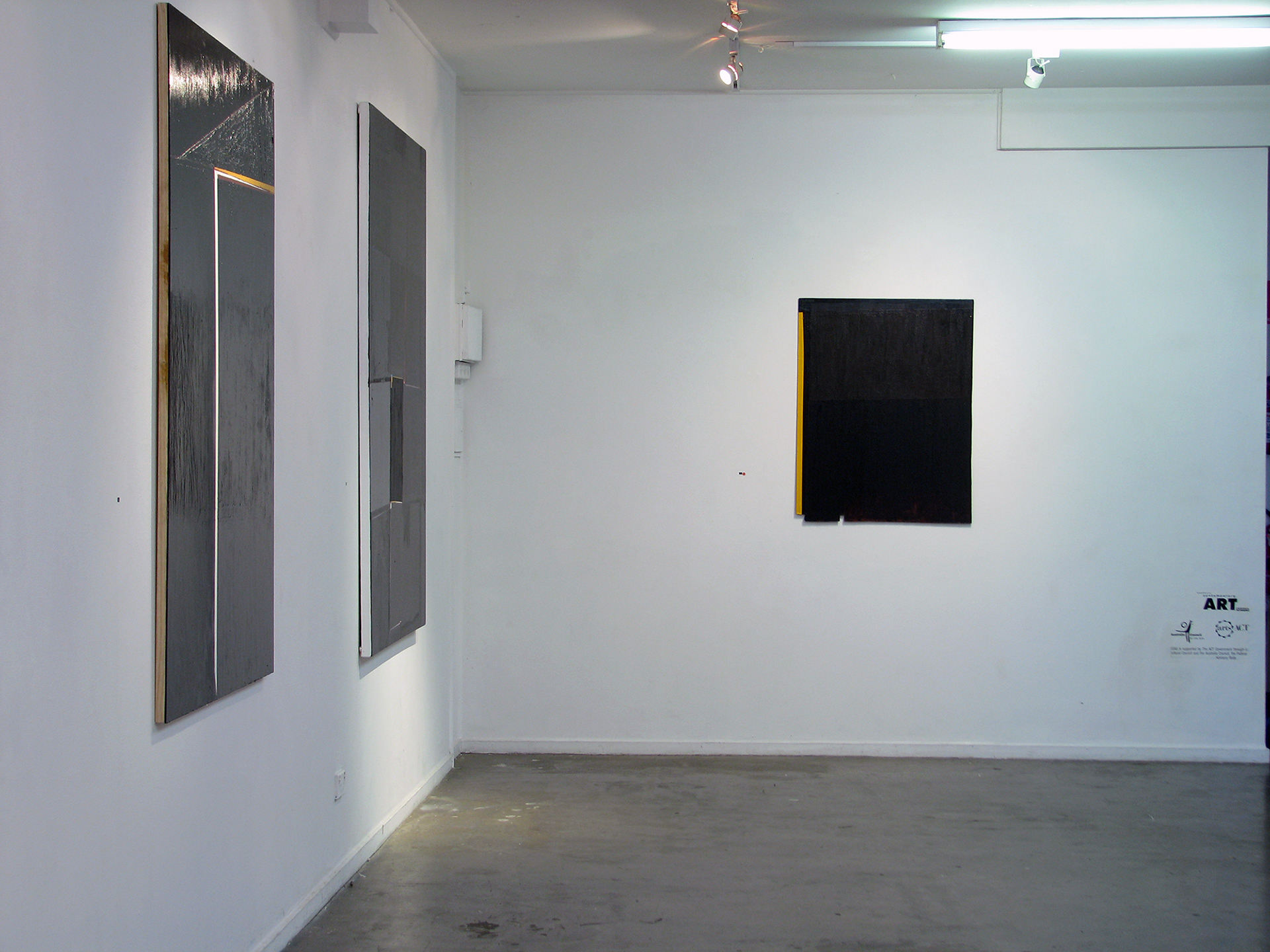 abstract paintings on a white wall