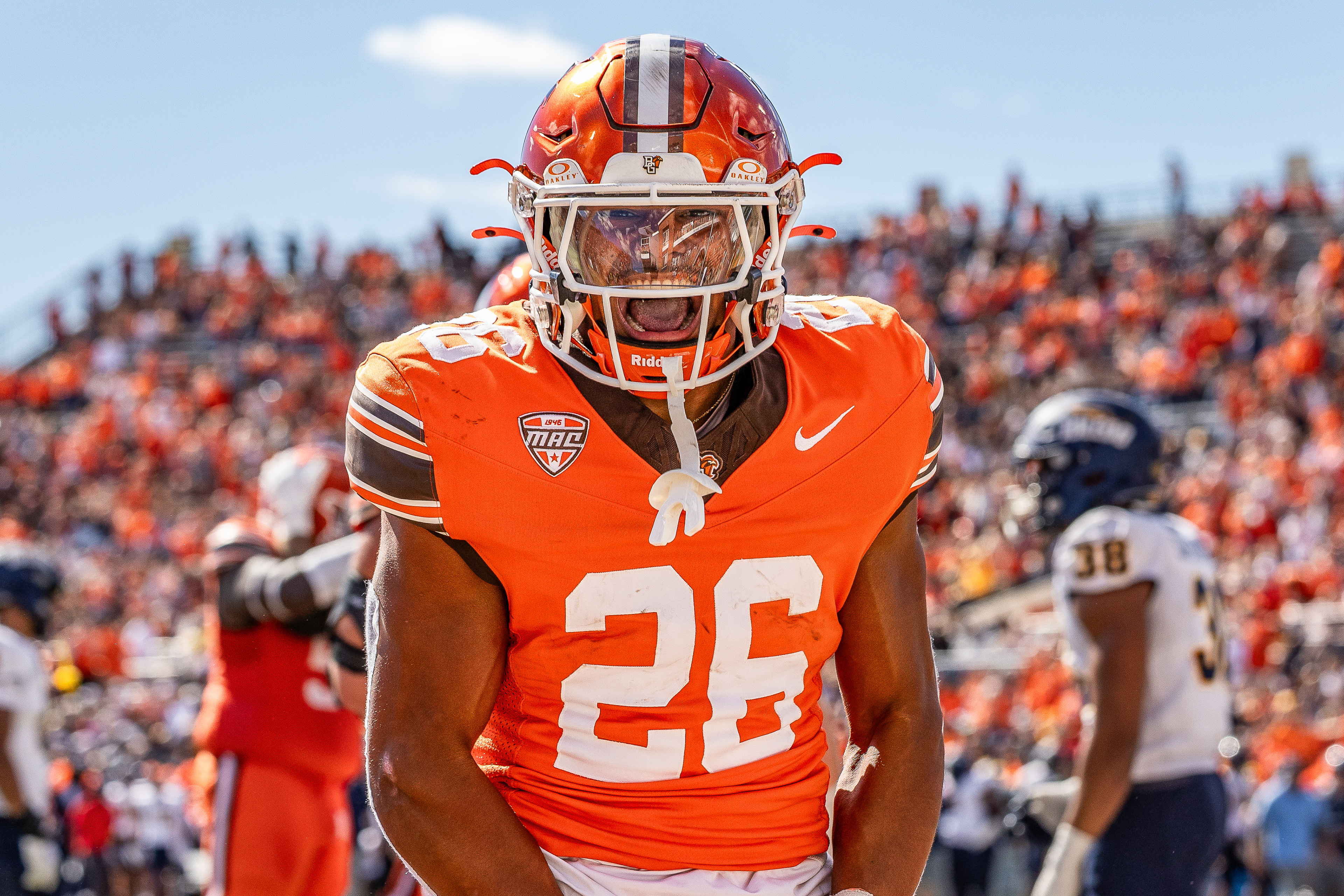BOWLING GREEN, OH - Falcons sophomore running back Cameron Pettaway (26) screams after crossing the goal-line during the Battle of I-75 against the Toledo Rockets at Doyt L. Perry Stadium in Bowling Green, Ohio. 