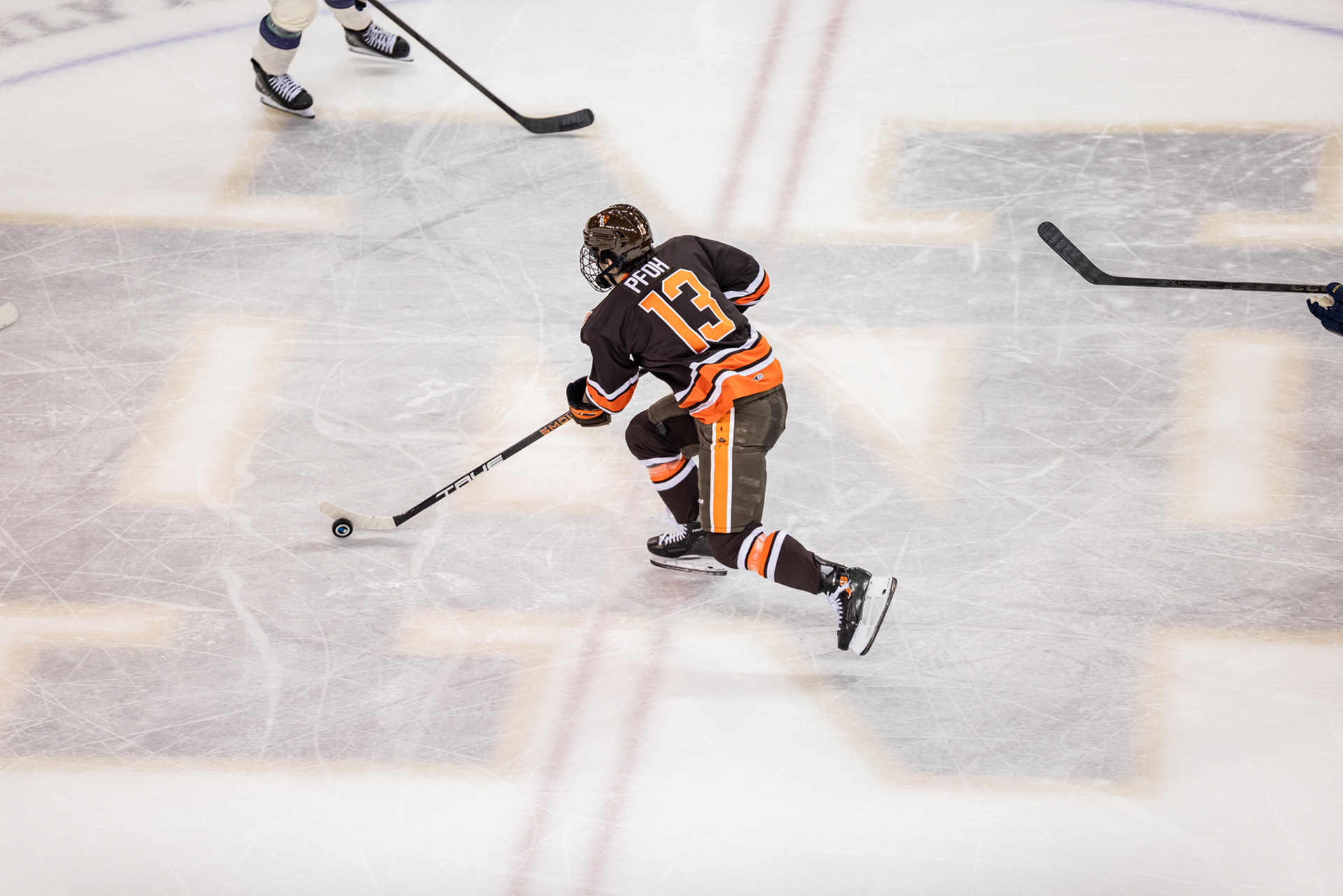 South Bend, IN - Falcons senior forward Brett Pfoh (13) skates over the Notre Dame logo during a game between the Bowling Green Falcons and the Notre Dame Fighting Irish at the Compton Family Ice Arena in South Bend, Indiana. 