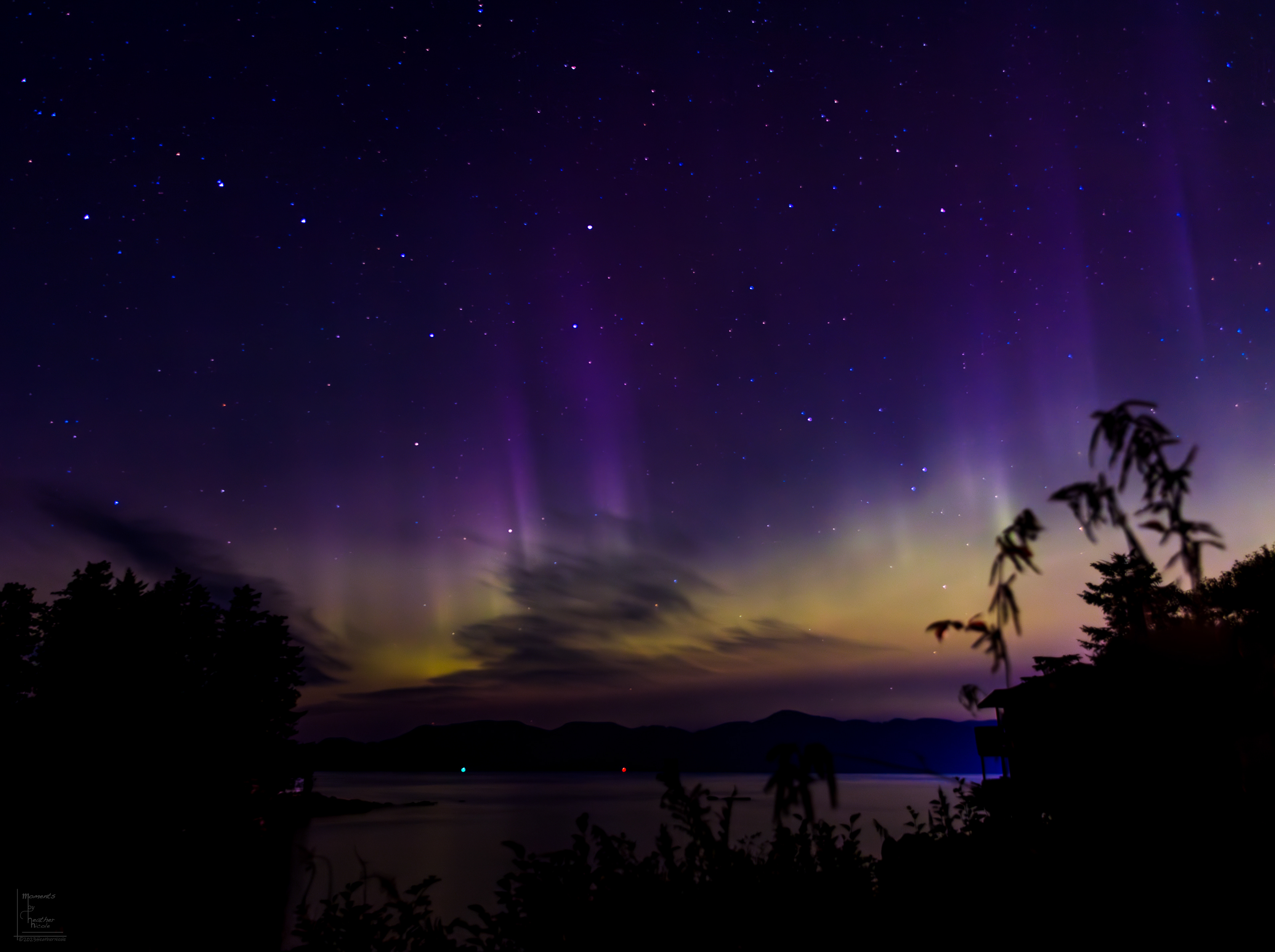 The sky is illuminated with the colors of a rainbow as the Northern Lights grace Sitka, Alaska with their truly awesome presence.