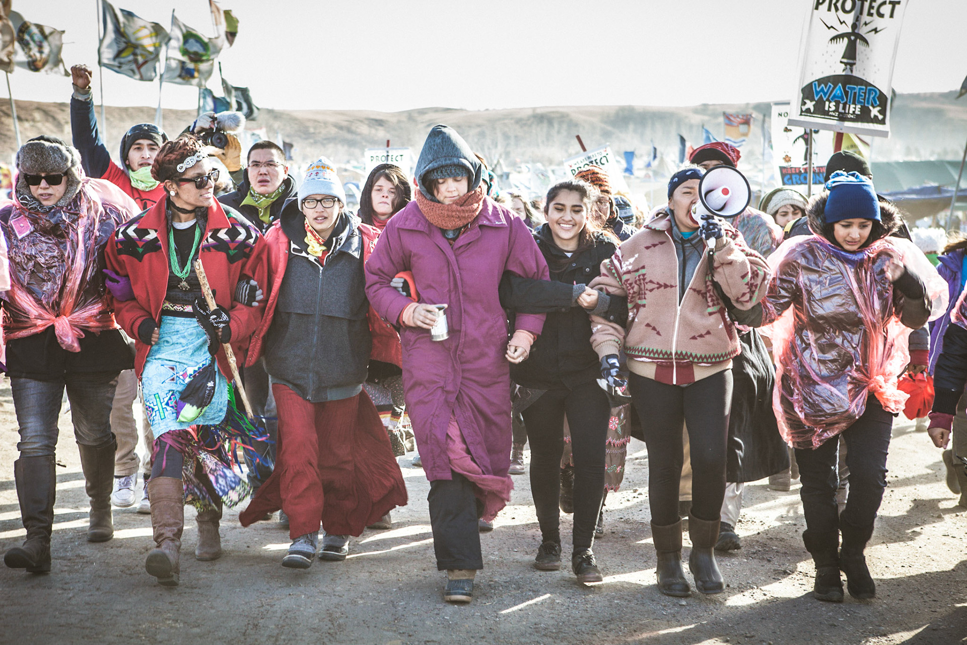 Women who have gathered from across the country march towards Backwater Bridge to show support for their fellow water protector Red Fawn. #freeredfawn #standingrock #nodapl #ocetisakowin #waterislife #dakotaaccesspipeline #togetherwearestrong Paul Newman Pictures ©2016