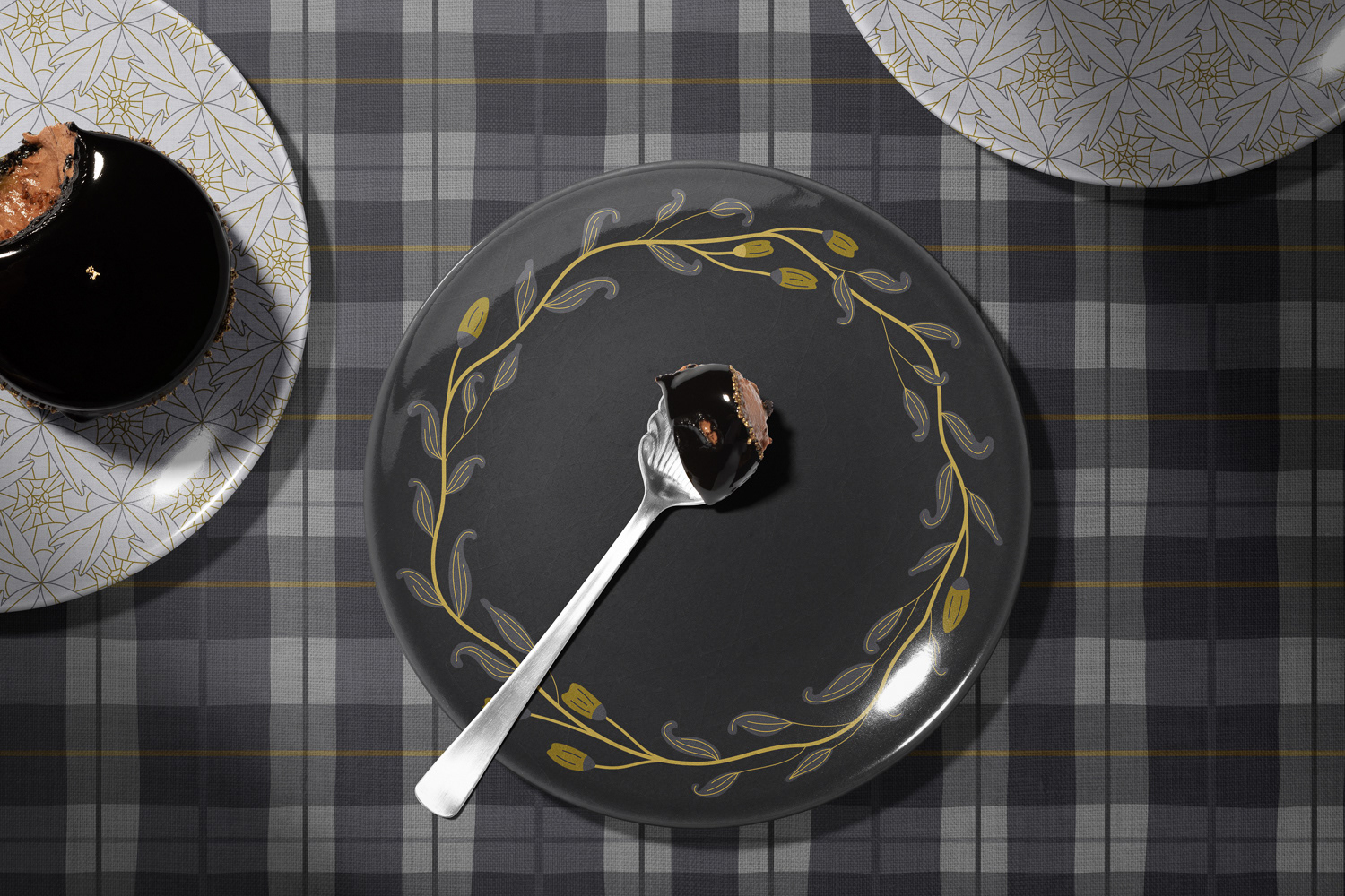 Botanical and plaid patterns in grey gold shown on tableware mockup by Mabel Chow, licensable surface design