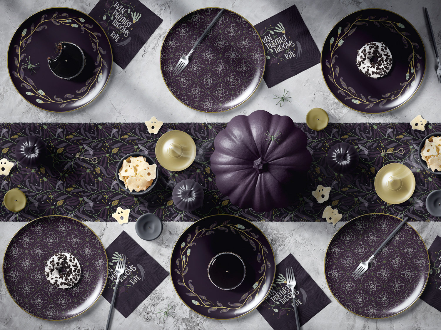 Botanical floral patterns and hand lettering shown in plum noir gold colorway on halloween tableware mockup by Mabel Chow