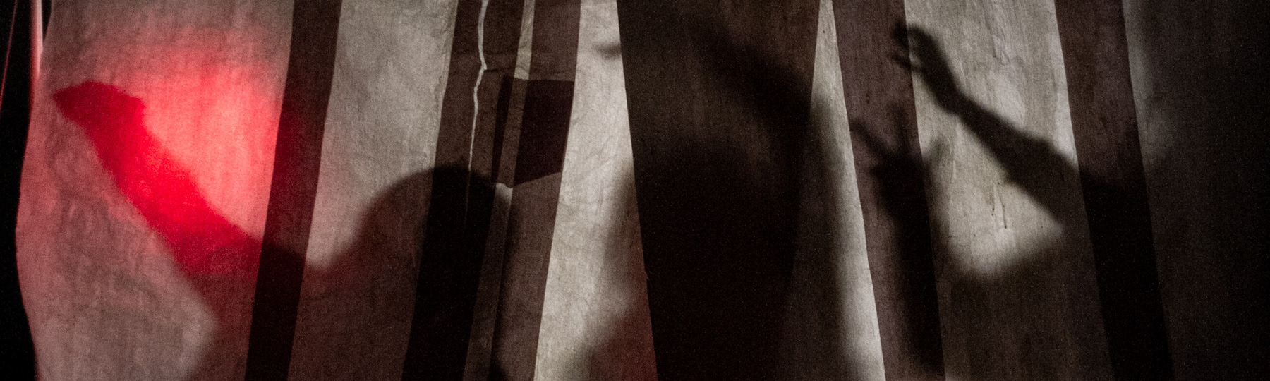 Shadows of the Underworld. Oscar Socias's moody shot of shadows on flour-glue welded paper with one red light diffusing.