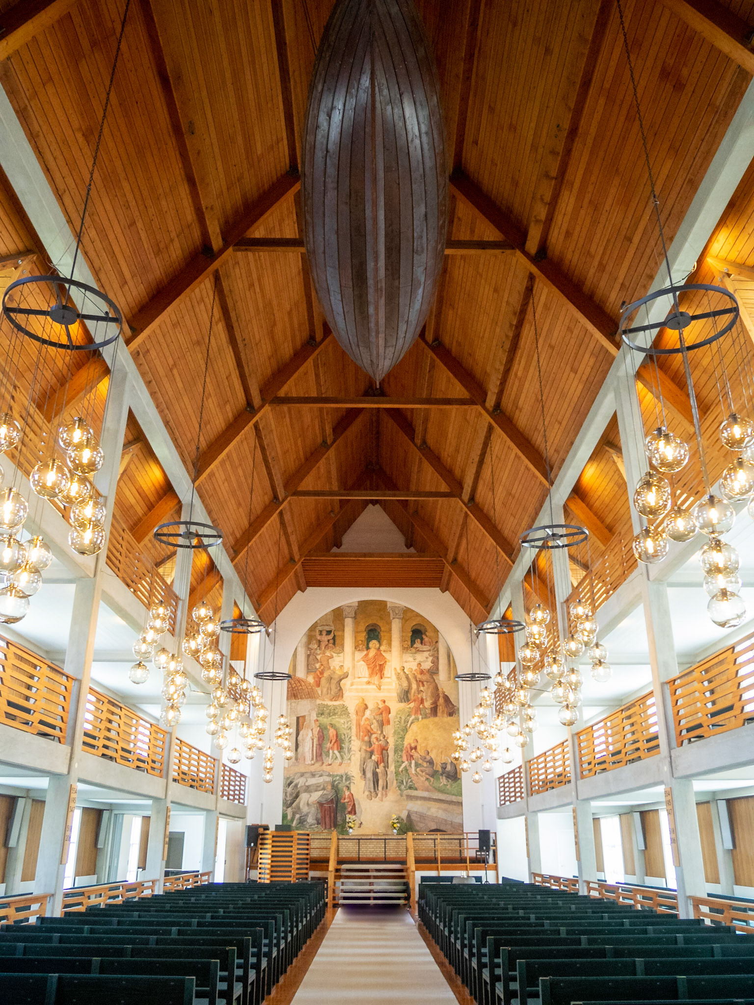 Klaksvík church interior, with traditional whaling boat hanging in the ceiling