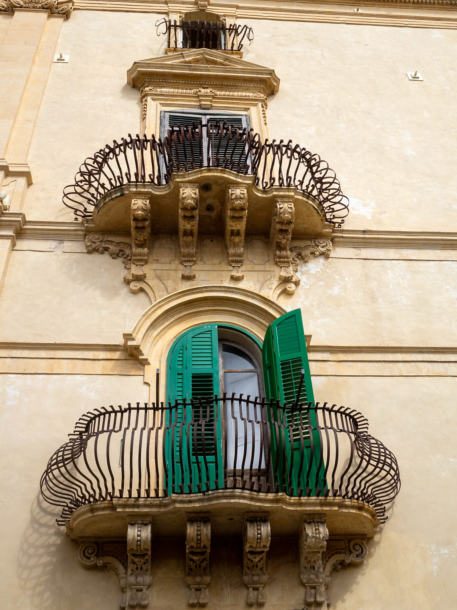 Stone carved balconies of Noto