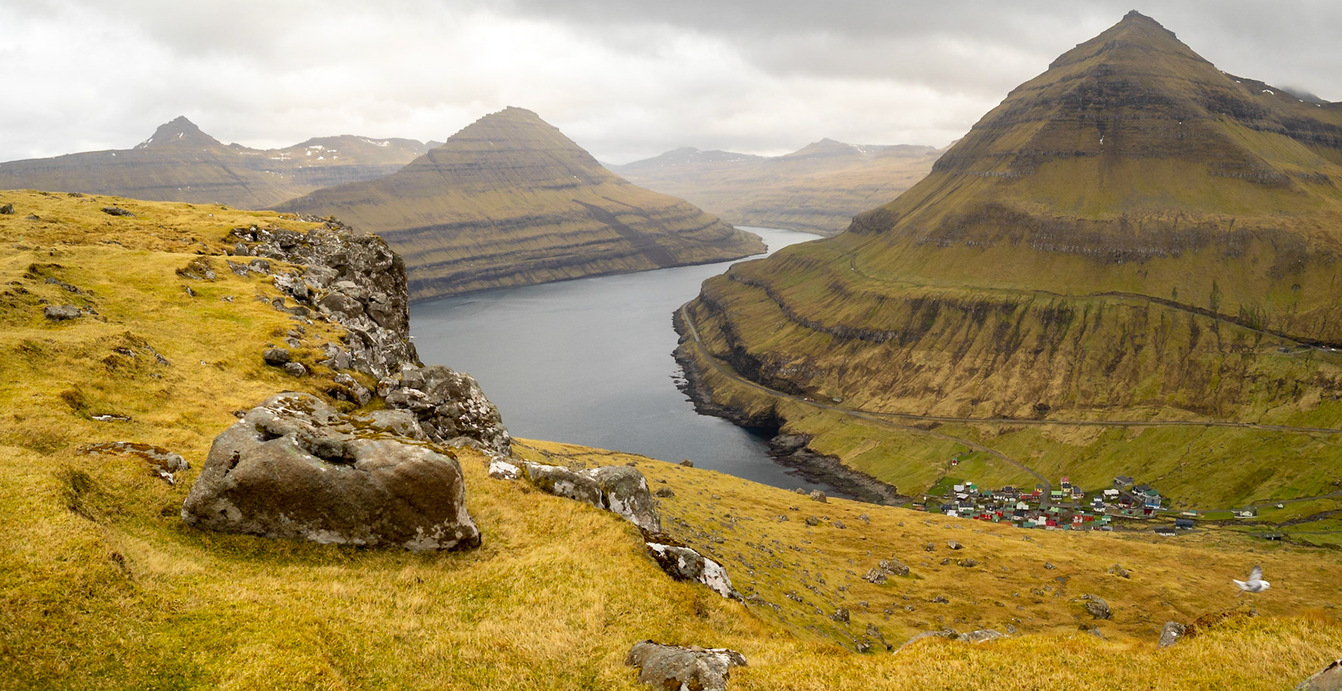 Funningur hamlet below Húsafjall mountain by Funningsfjørður fjord seen from Gongutúrur / Hvithamar trailhead