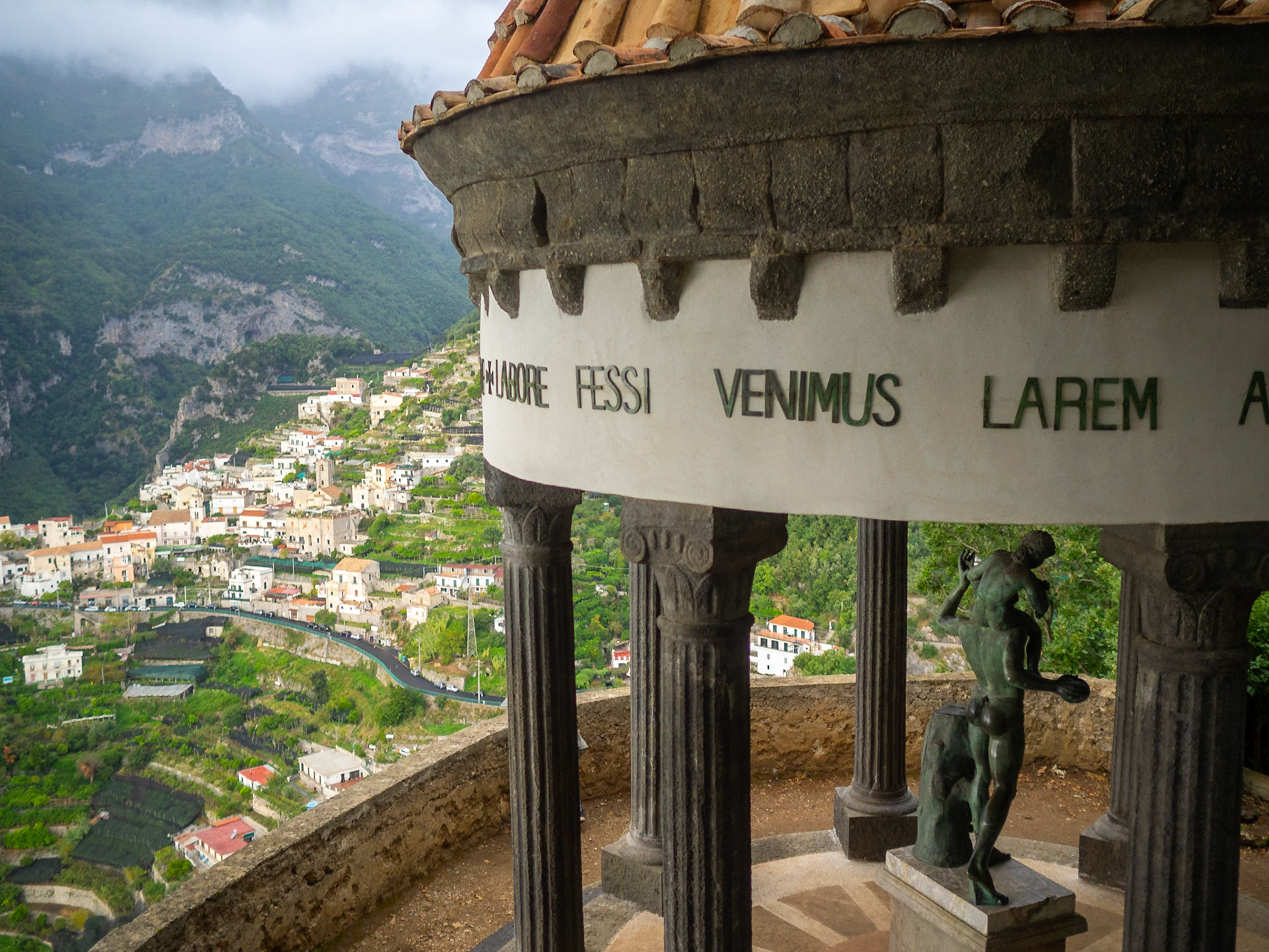The Temple of Bacchus in Villa Cimbrone gardens with the mountains in background