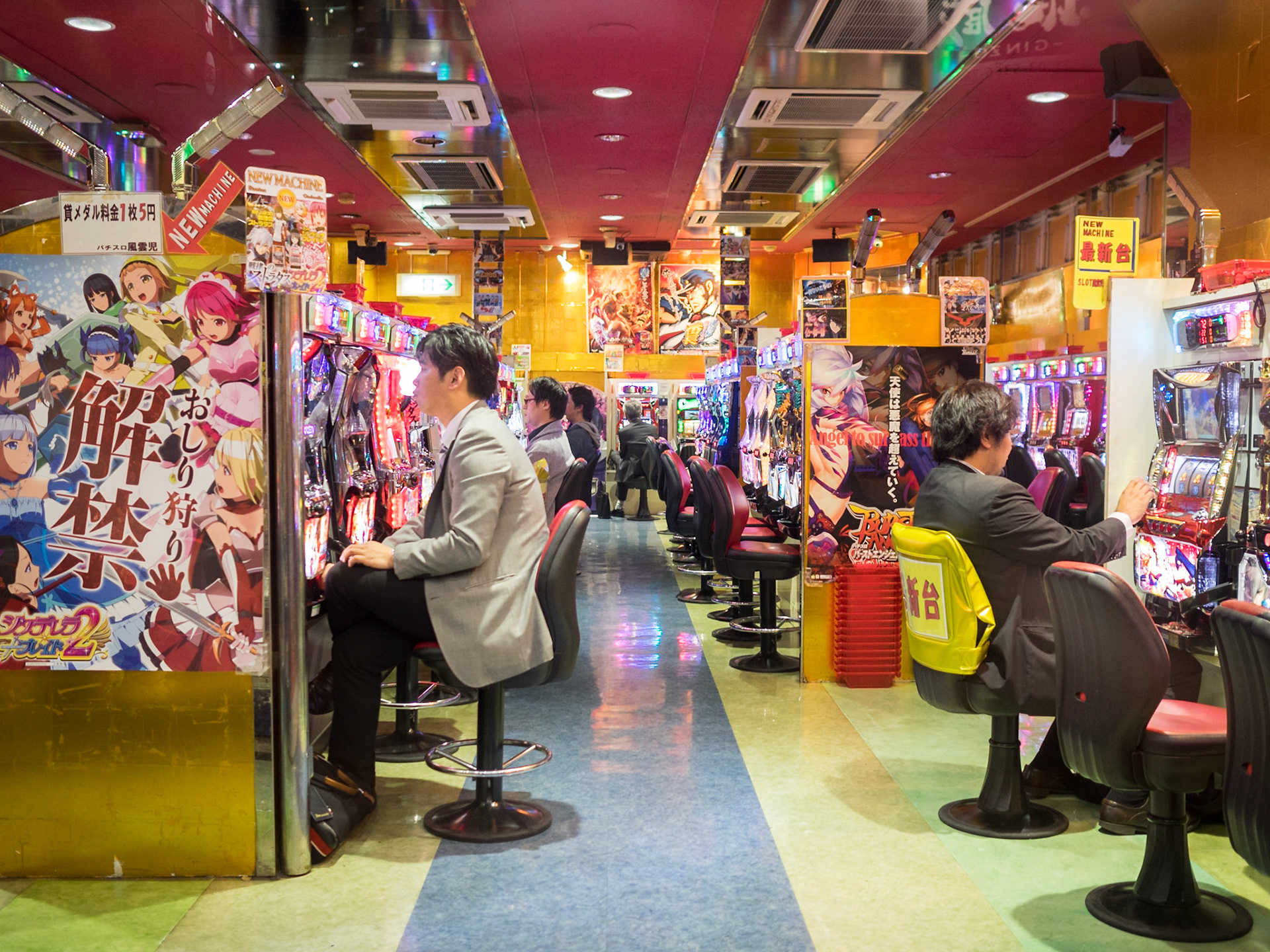 Man playing pachinko in a Tokyo game house