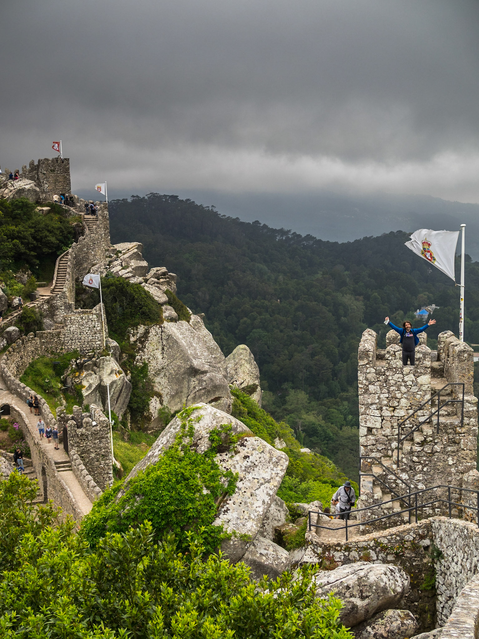 Tourists walking along Sintra's Moorish Castle walls