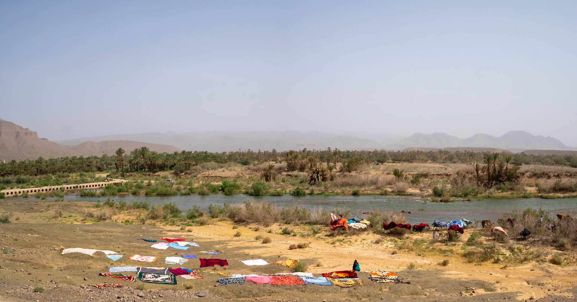 Draa River landscape with drying clothes, Morocco