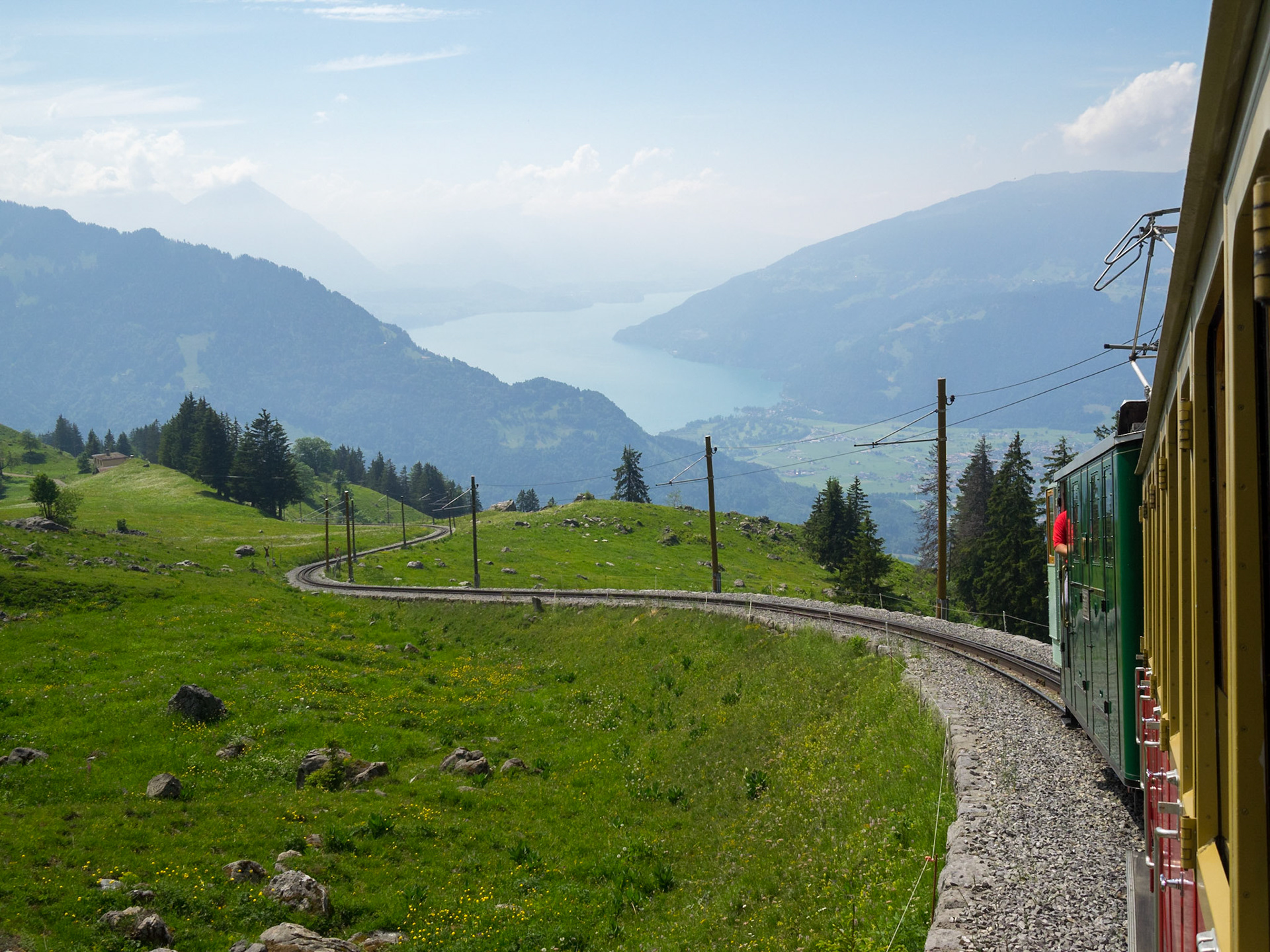 Going uphill in Schynige Platte Railway with Lake Thun in the background