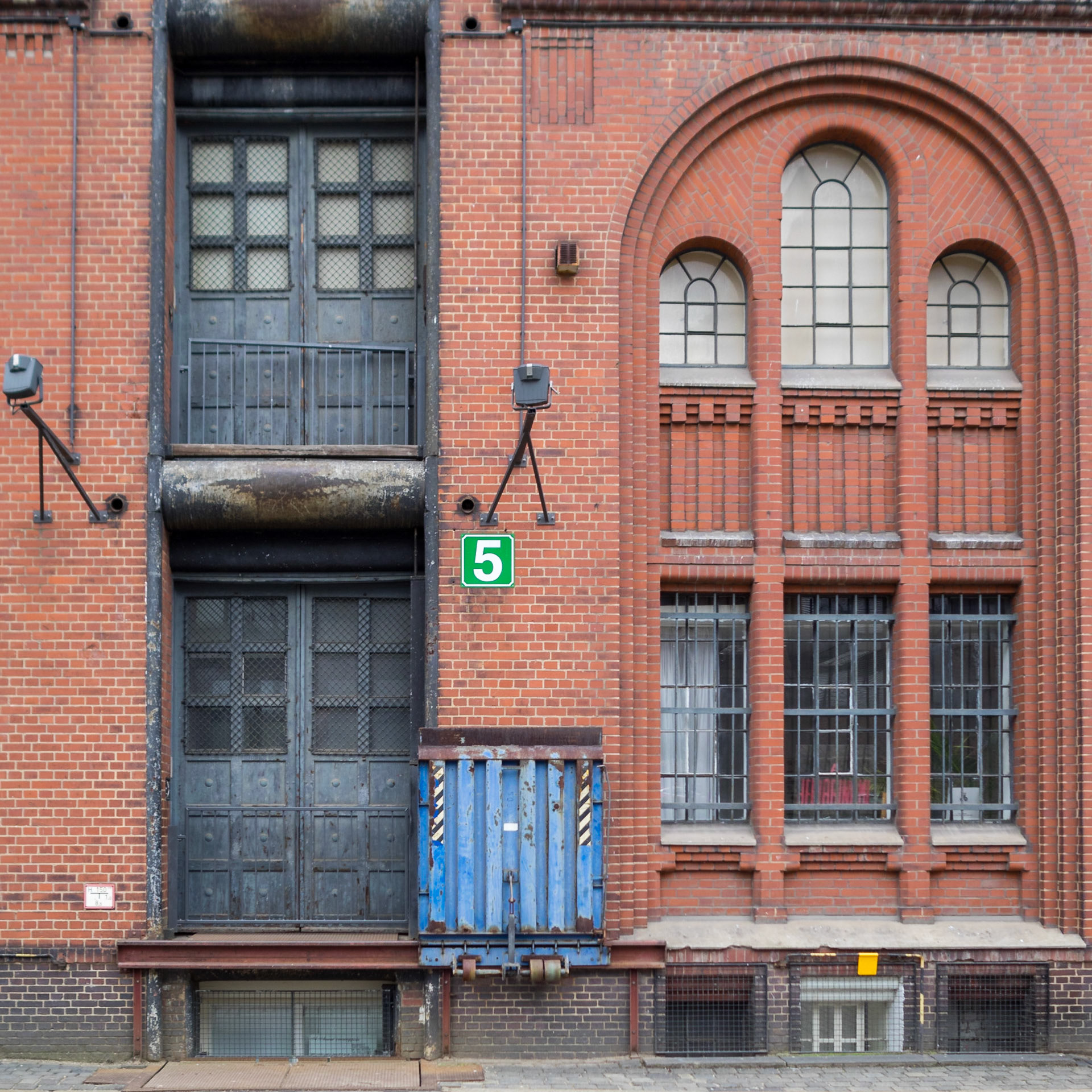 Hafen City industrial red brick building facade with hoist