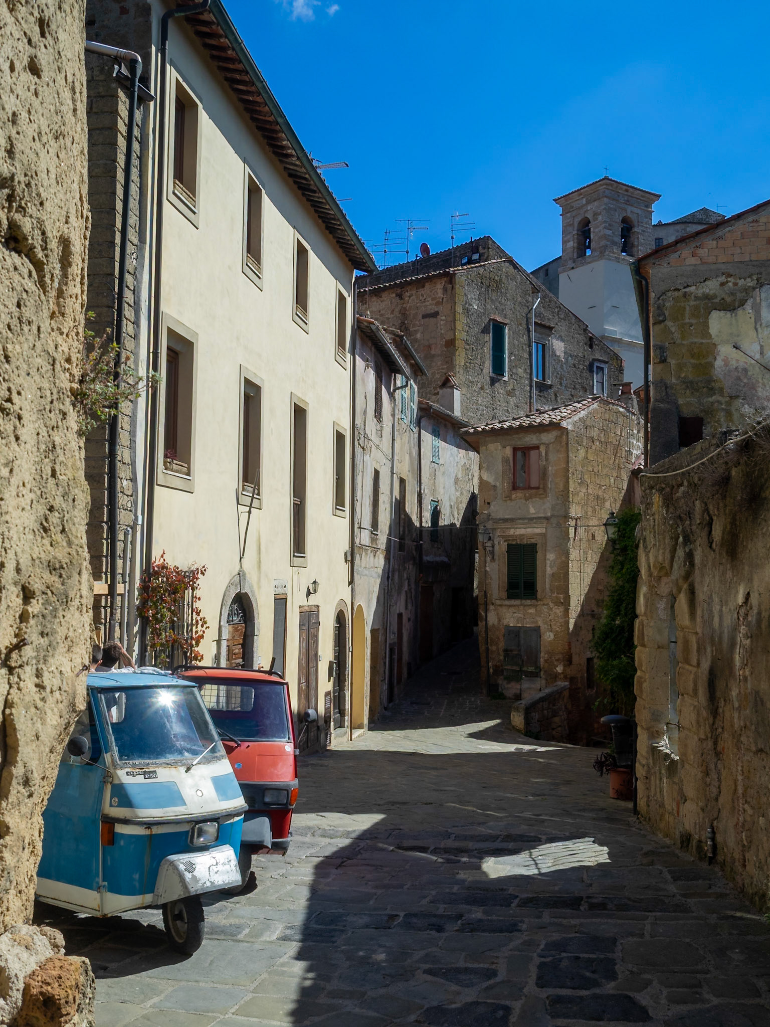 Piaggio tricycles parked in Sorano street