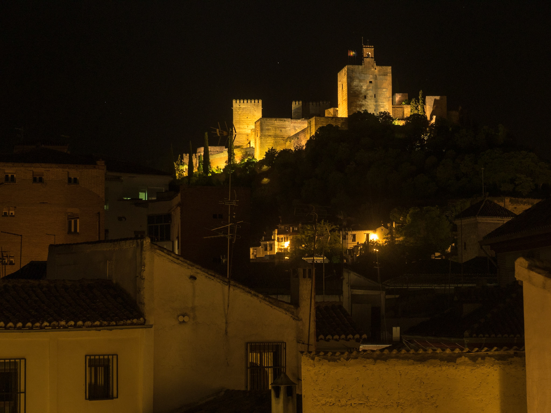 Night view over Granada roofs to Allambra
