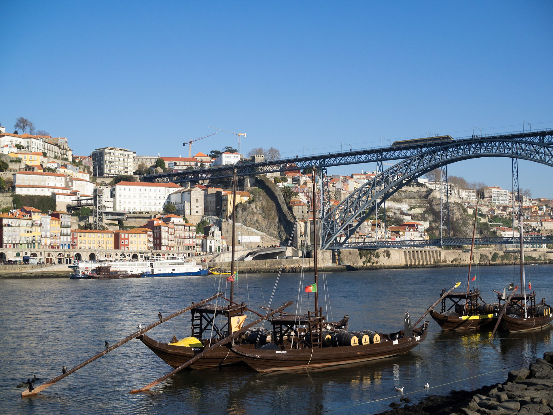 Boats in Douro River by Dom Luis Bridge, Oporto