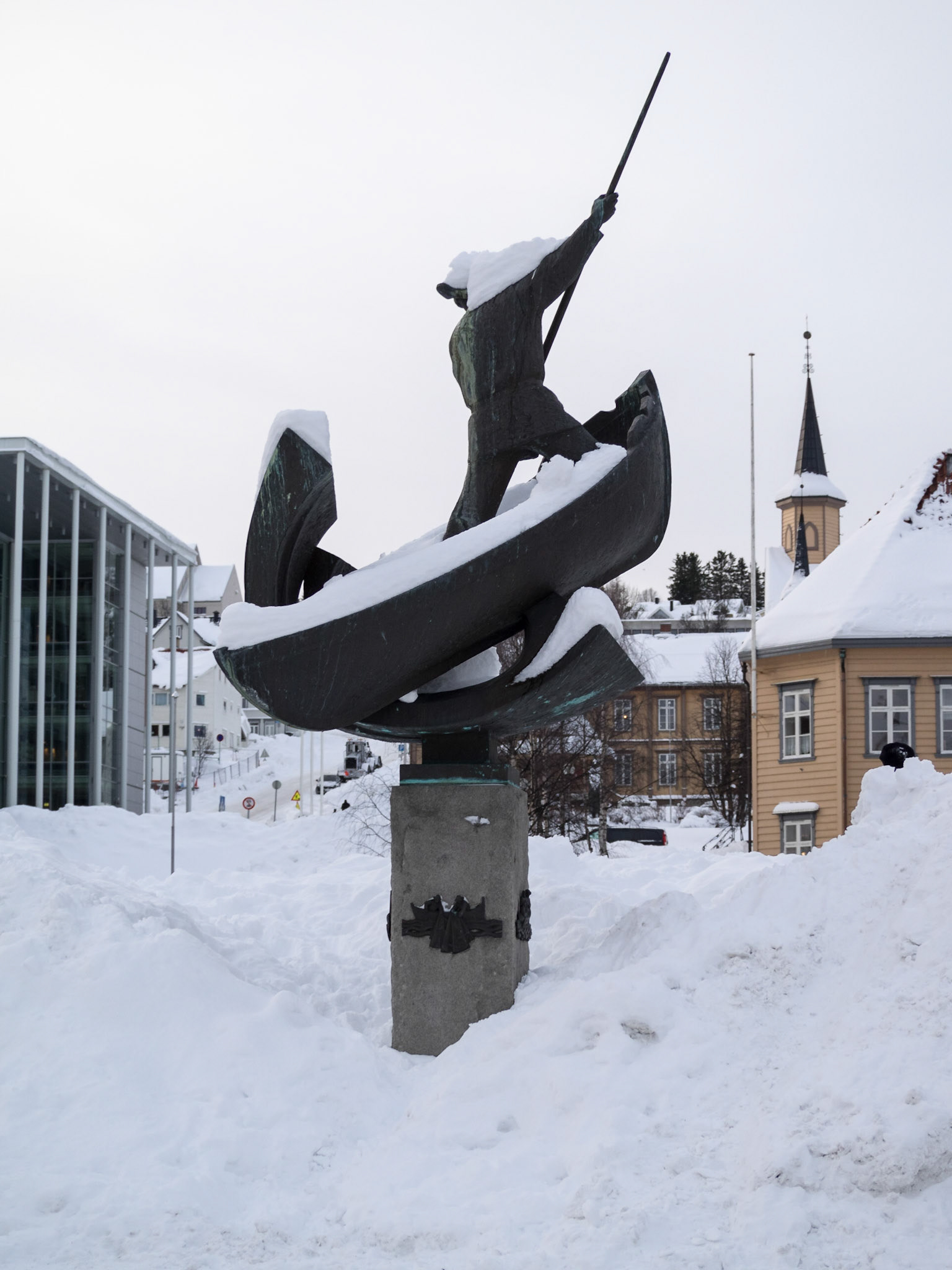 Snow covered fisherman statue in Tromso square