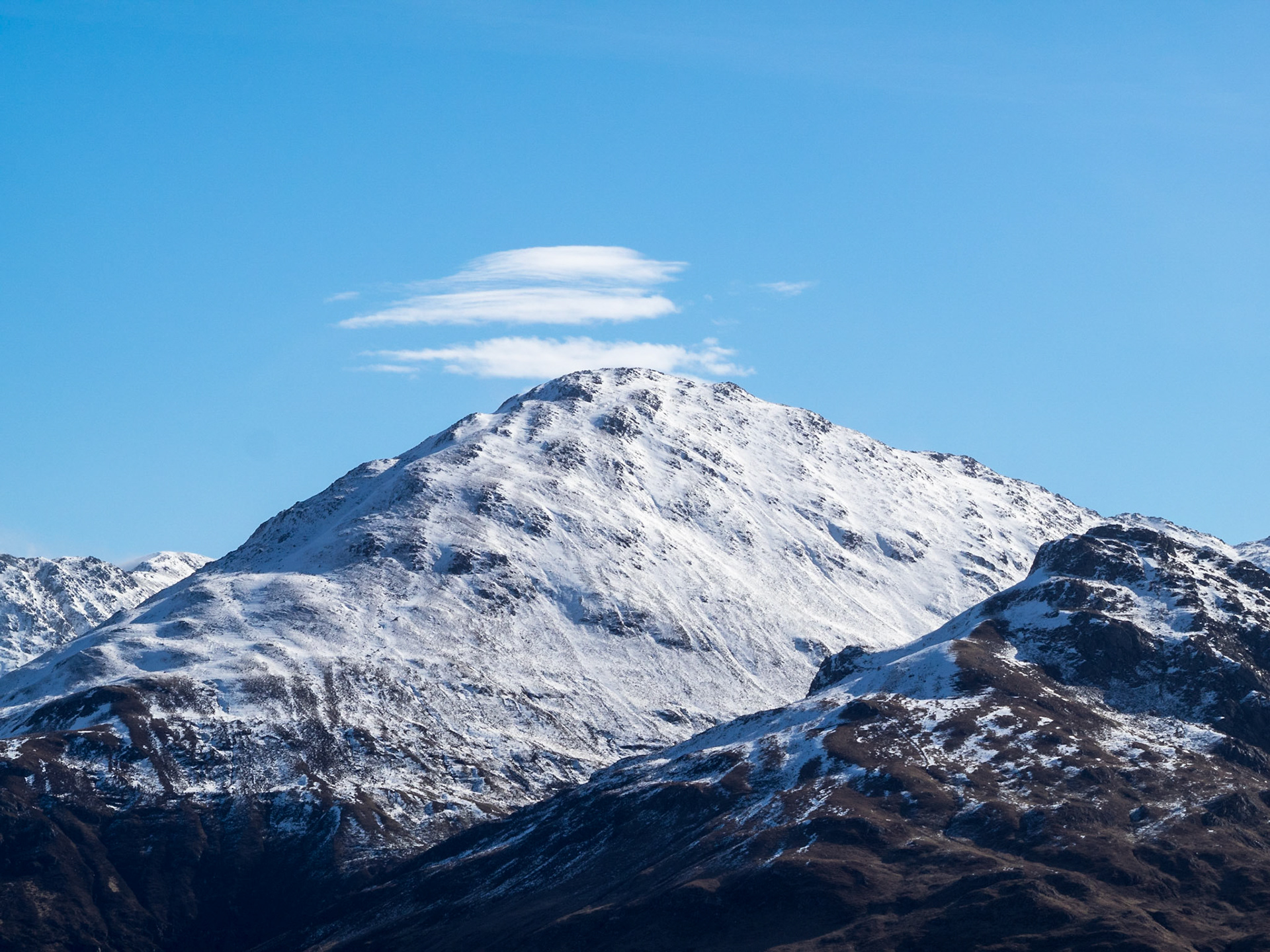 Snow covered mountain peak near Loch Duich