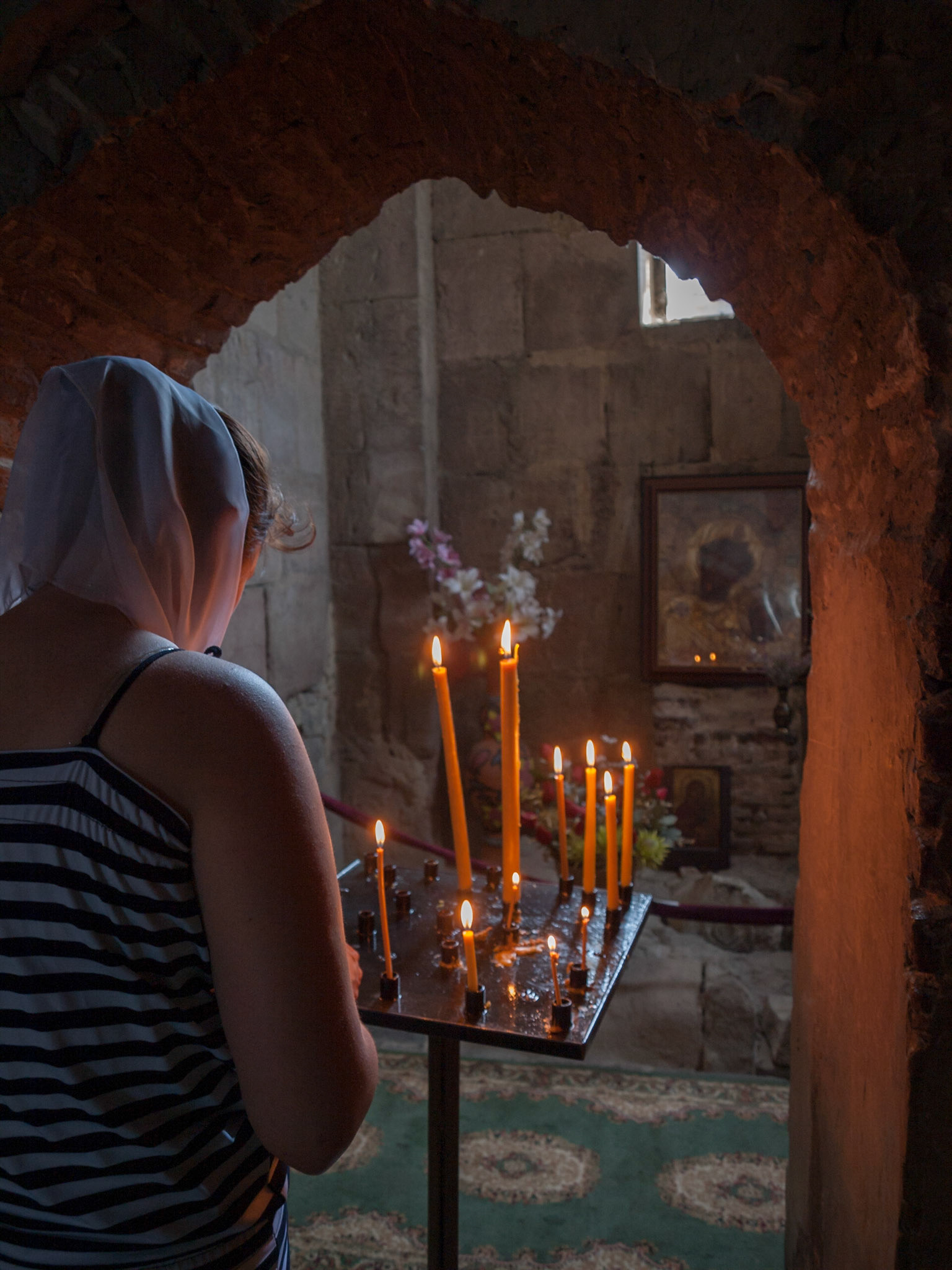 Woman praying inside Jvari church, Mtskheta