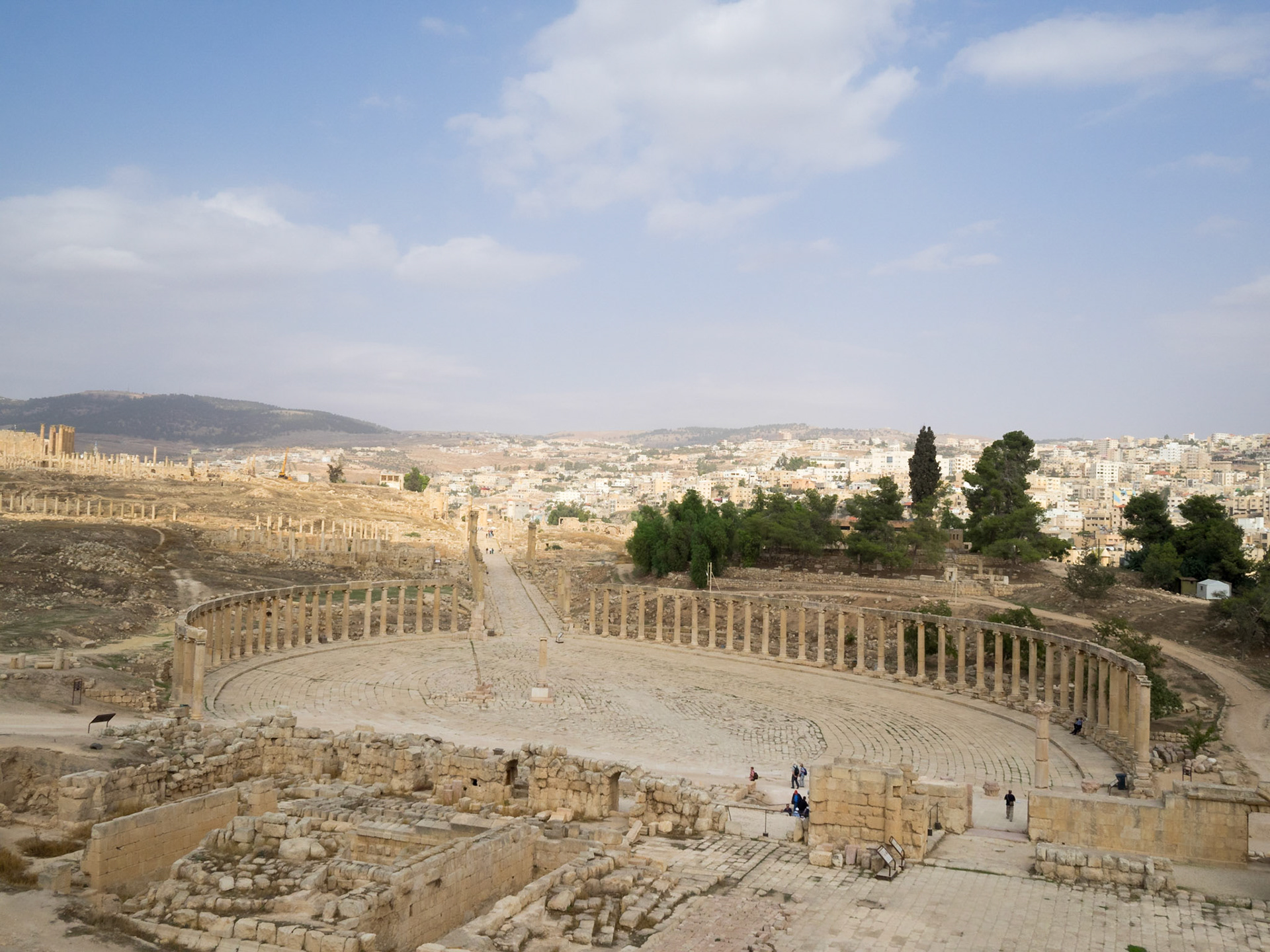 Oval Forum and Cardo of Jerash Roman city with the new city in background