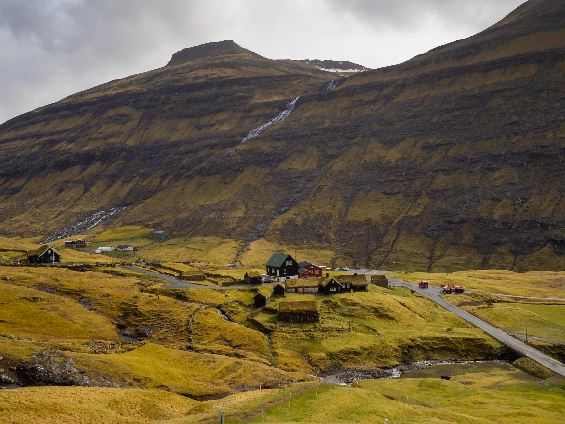 Saksun turf roofed houses in the middle of the green grass fields