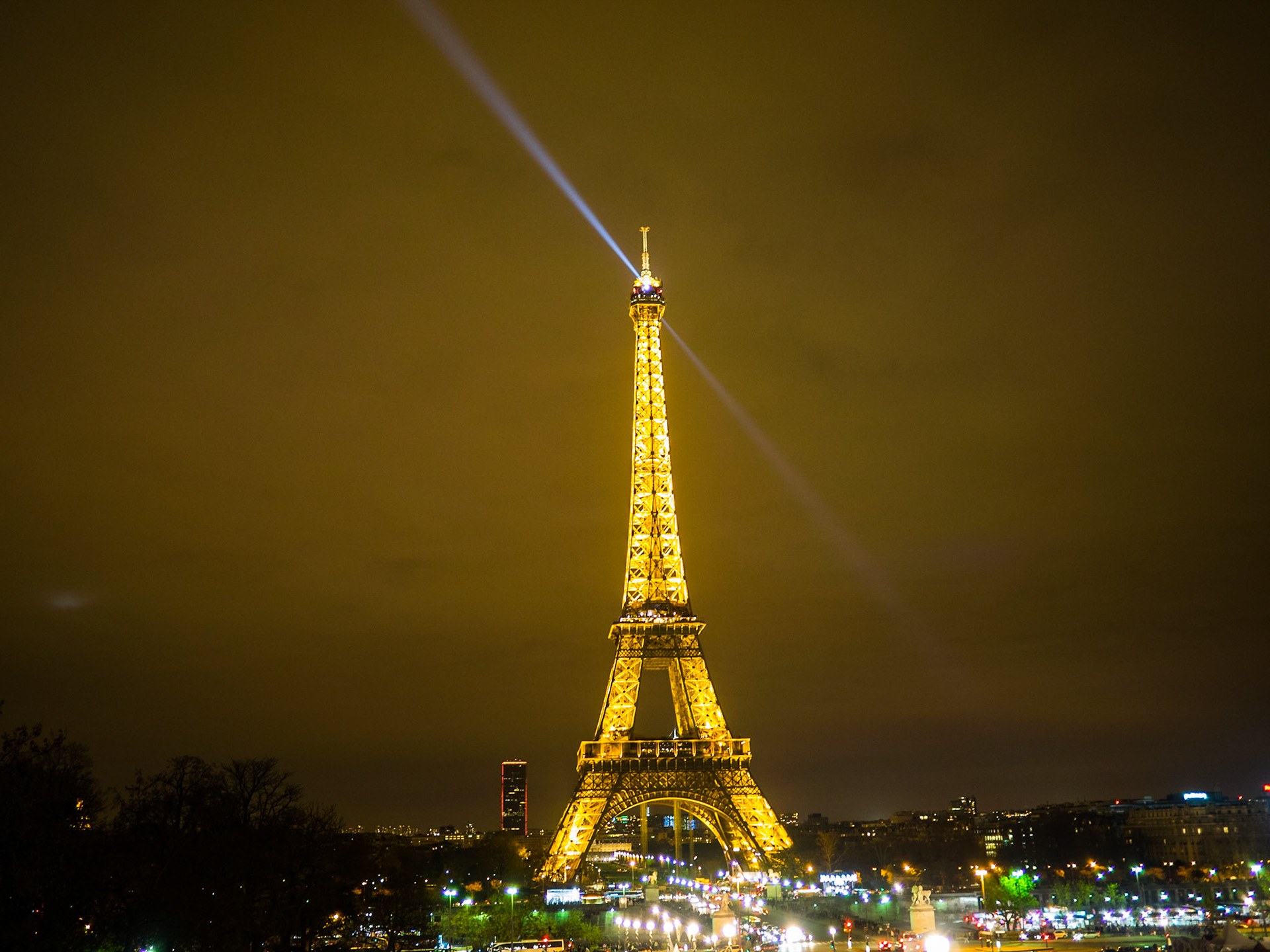 Eiffel tower and spotlight at night