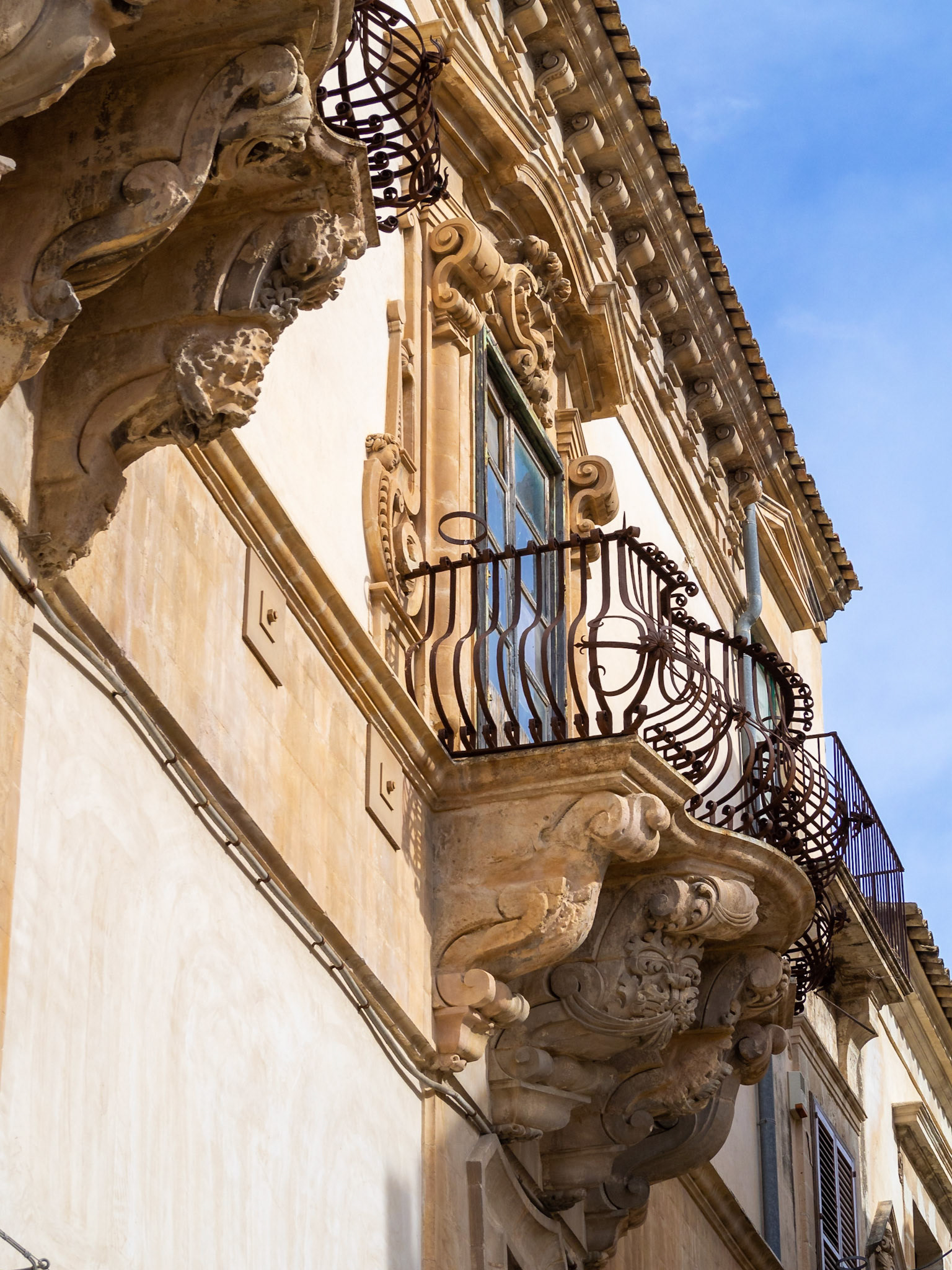 Stone carving work of the balconies of the Baroque Palazzo Beneventano, Scicli