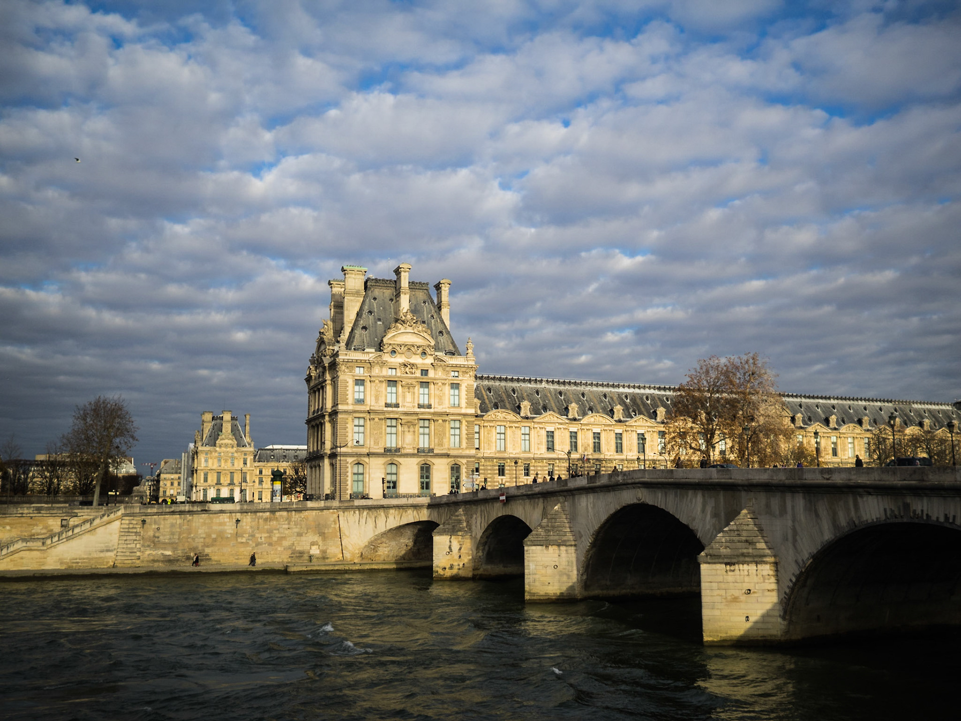 Pont du Carrousel over Seine river and Louvre museum