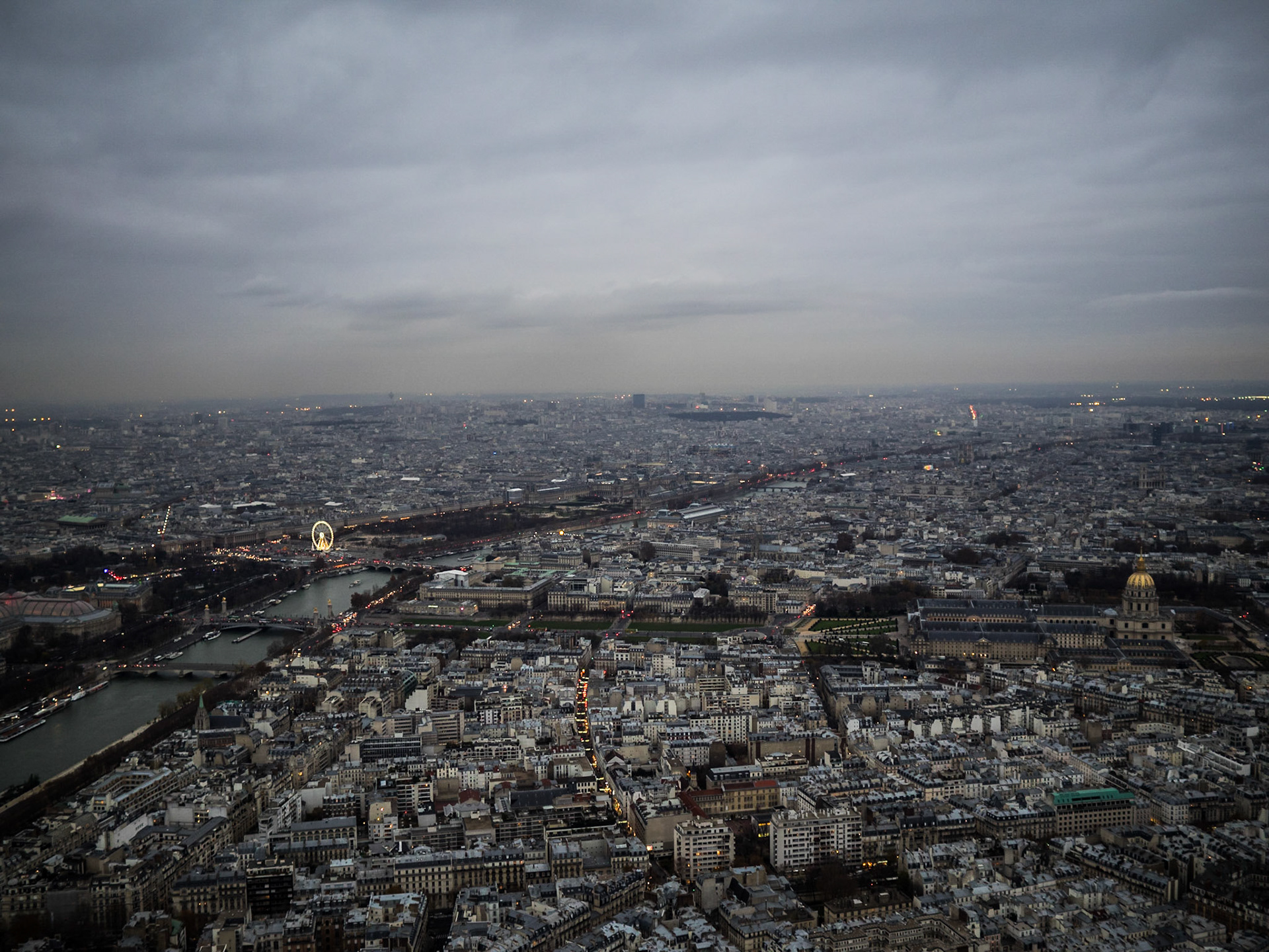 Gray skies over Paris and Seine river seen from Eiffel tower top