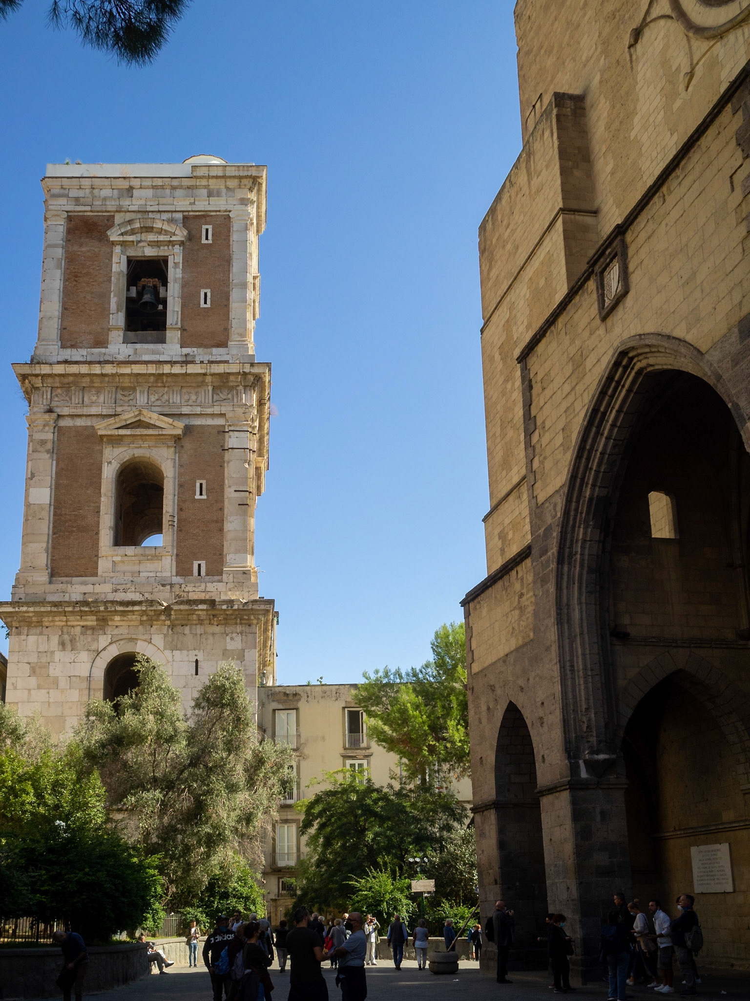 Bell tower and doorway of the Complesso Monumentale di Santa Chiara, Naples