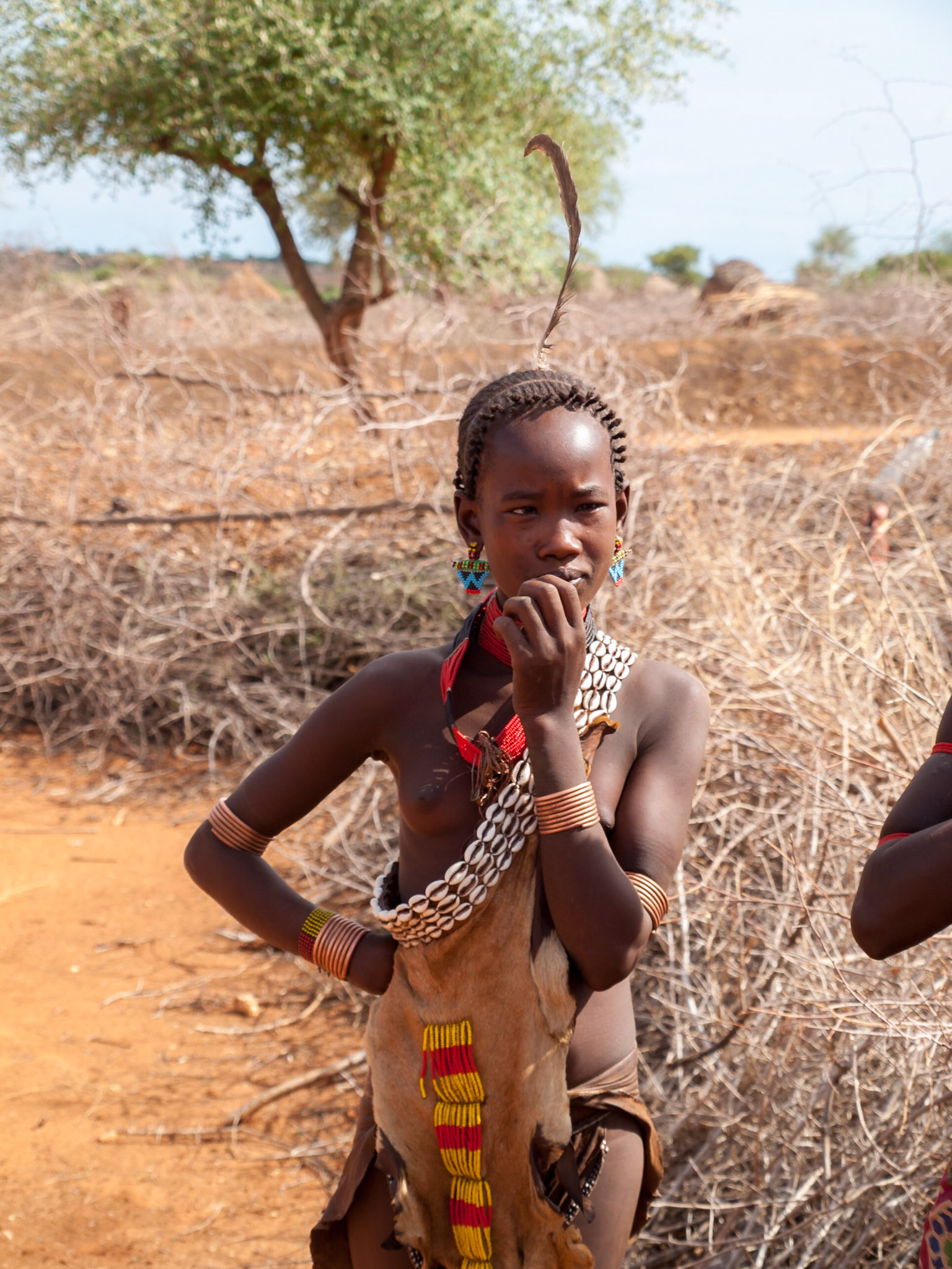 Young Hamer girl with traditional dress and jewelry