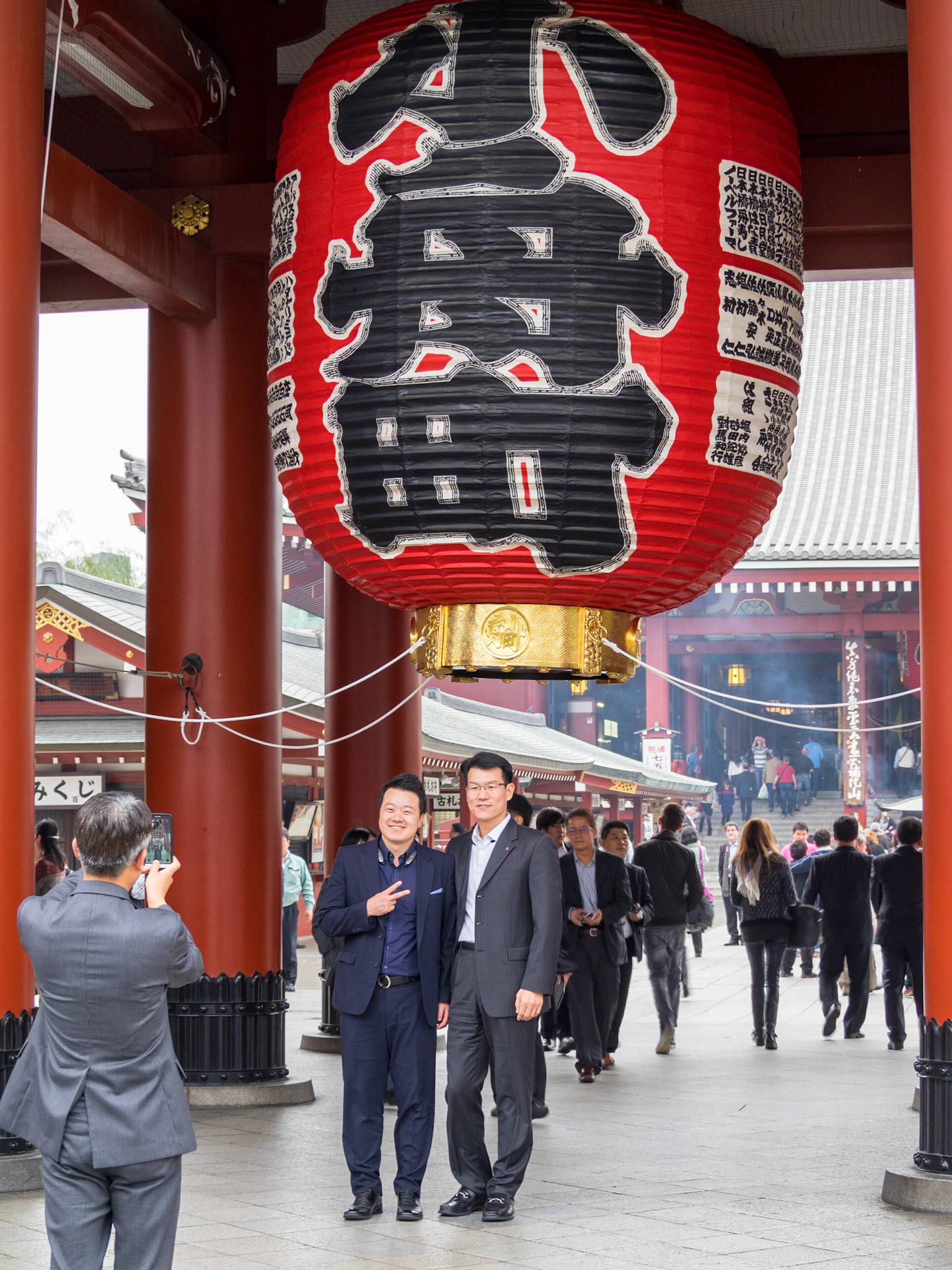 Taking pictures under Senso-ji temple balloon