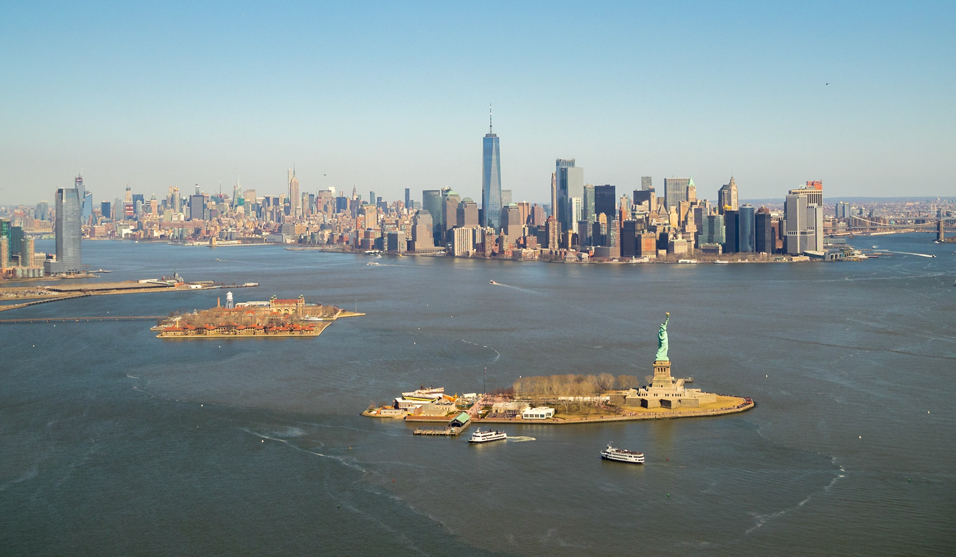 Liberty and Ellis Islands and downtown Manhattan seen from an helicopter ride over New York Bay
