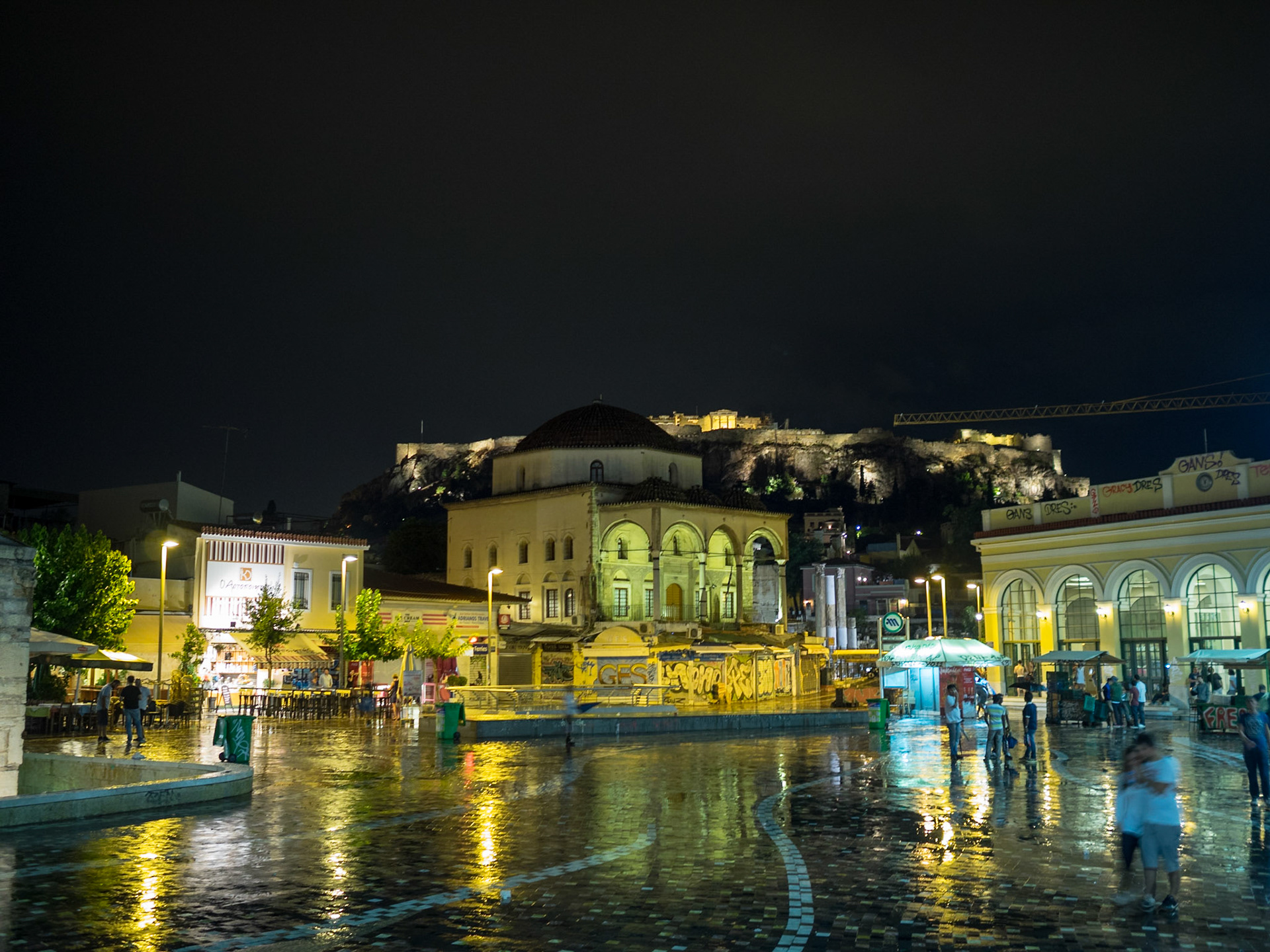 Plateia Monastirakiou square at night after the rain with the Acropolis in background