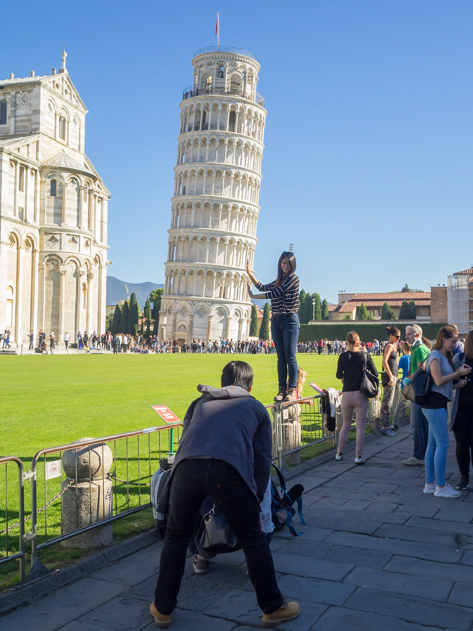 Taking a photo holding Pisa Leaning Tower