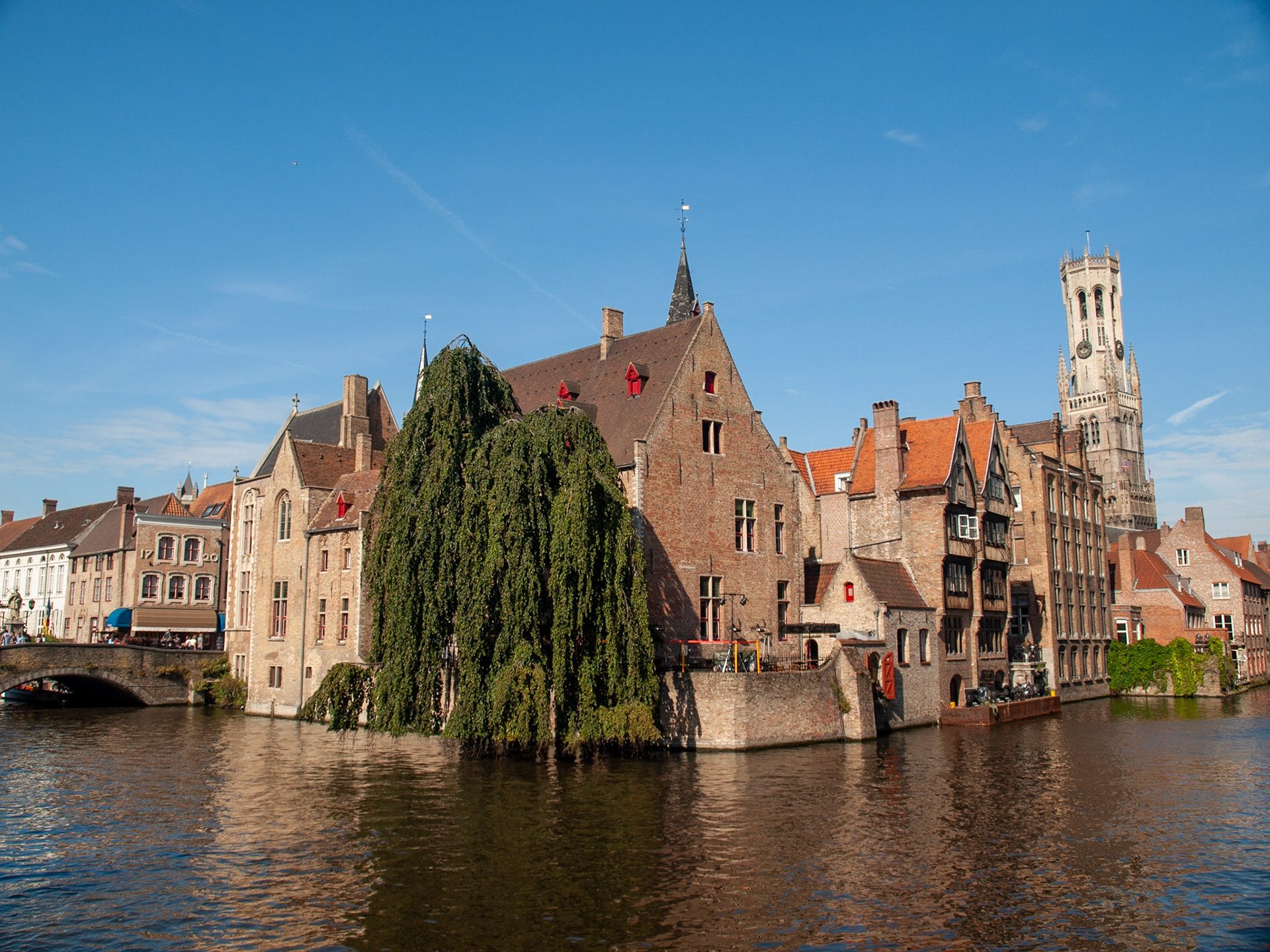 Bruges canal with Belfort tower in background