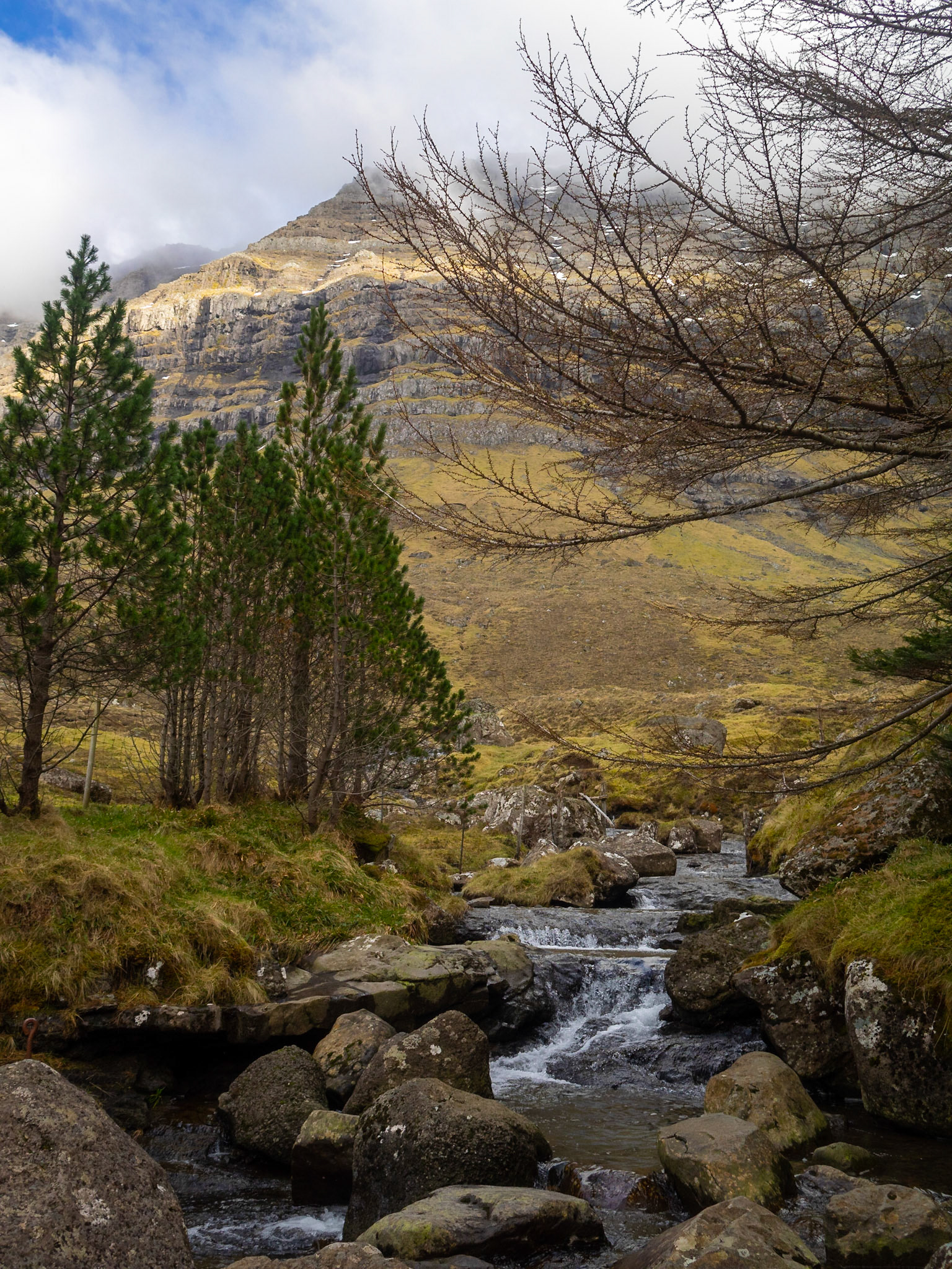 Kunoy park with a cascade brook passing through