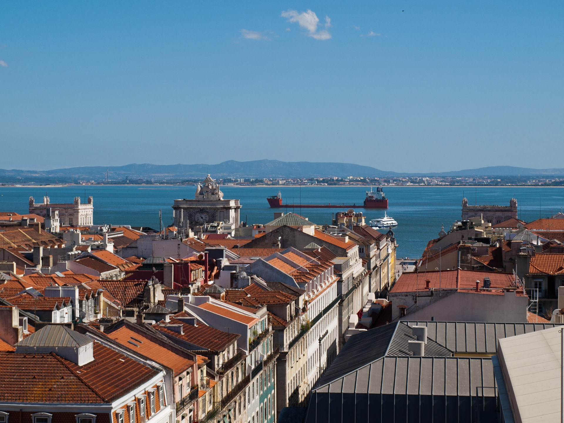 Downtown Lisbon view of roofs and the river Tagus