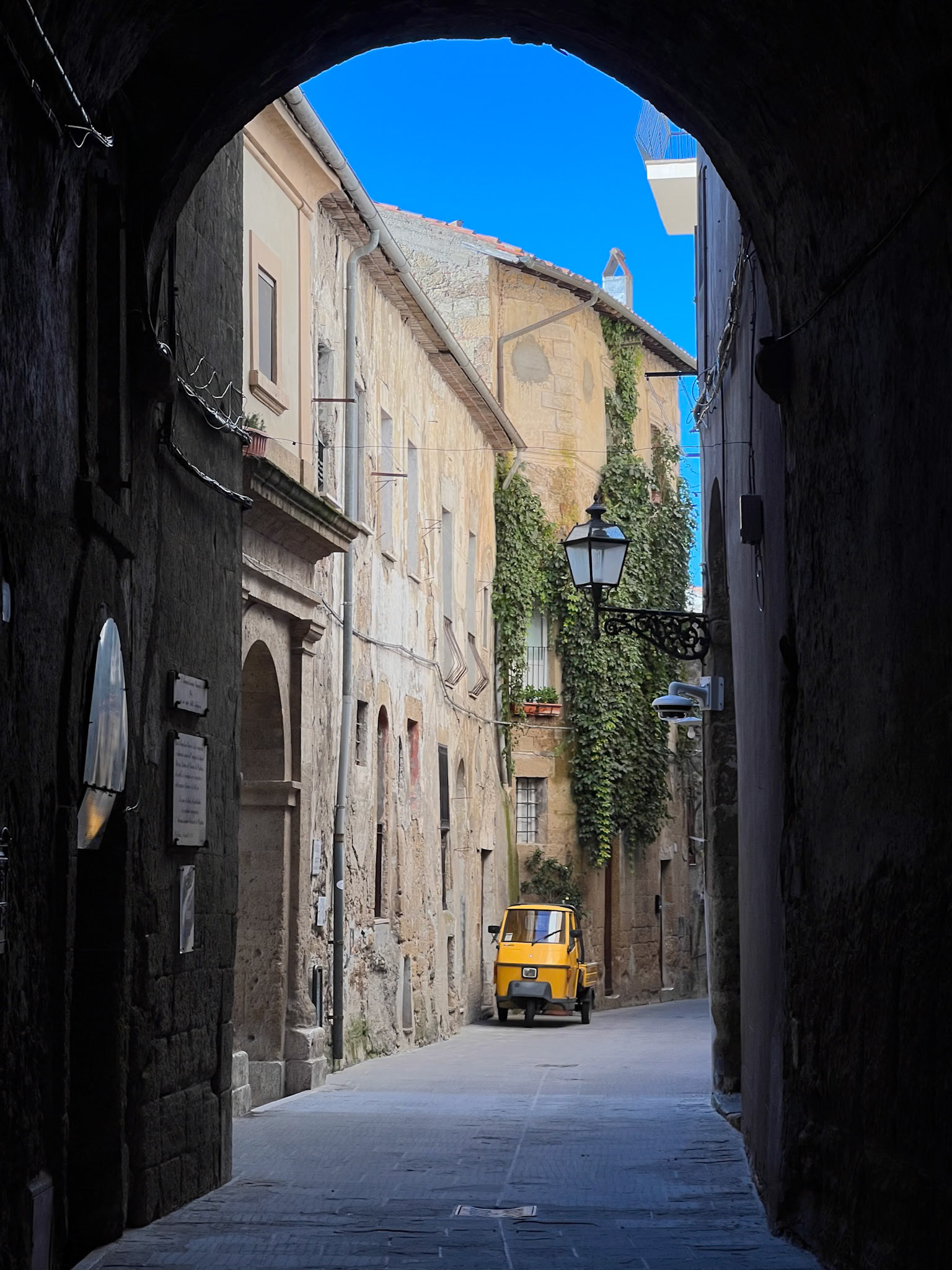 Narrow Pitigliano street with an arch