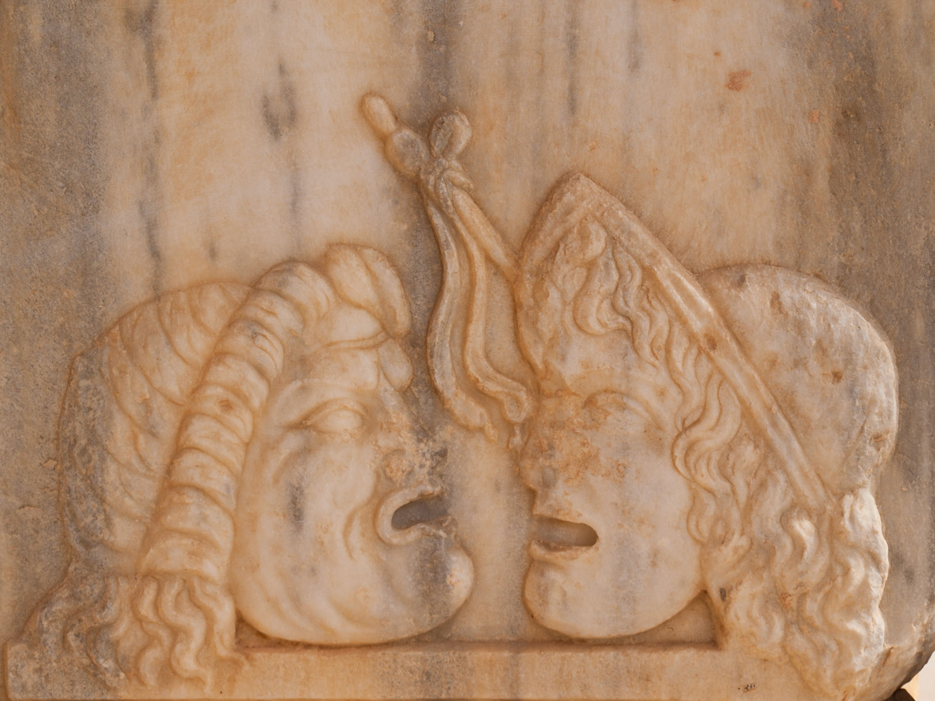 Roman ruins of Sabratha theater stage detail with masks