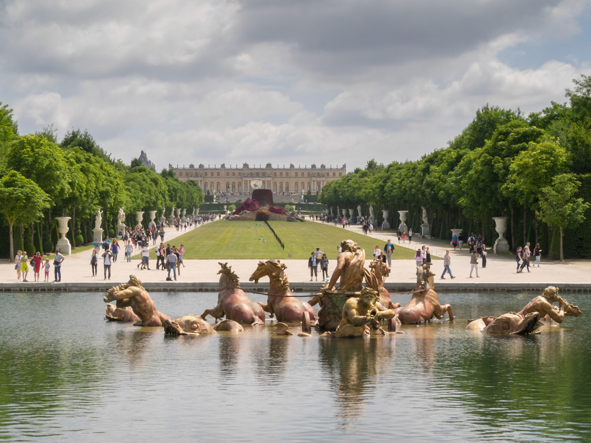 Versailles palace fountain and main garden mall with the palace building in the far out