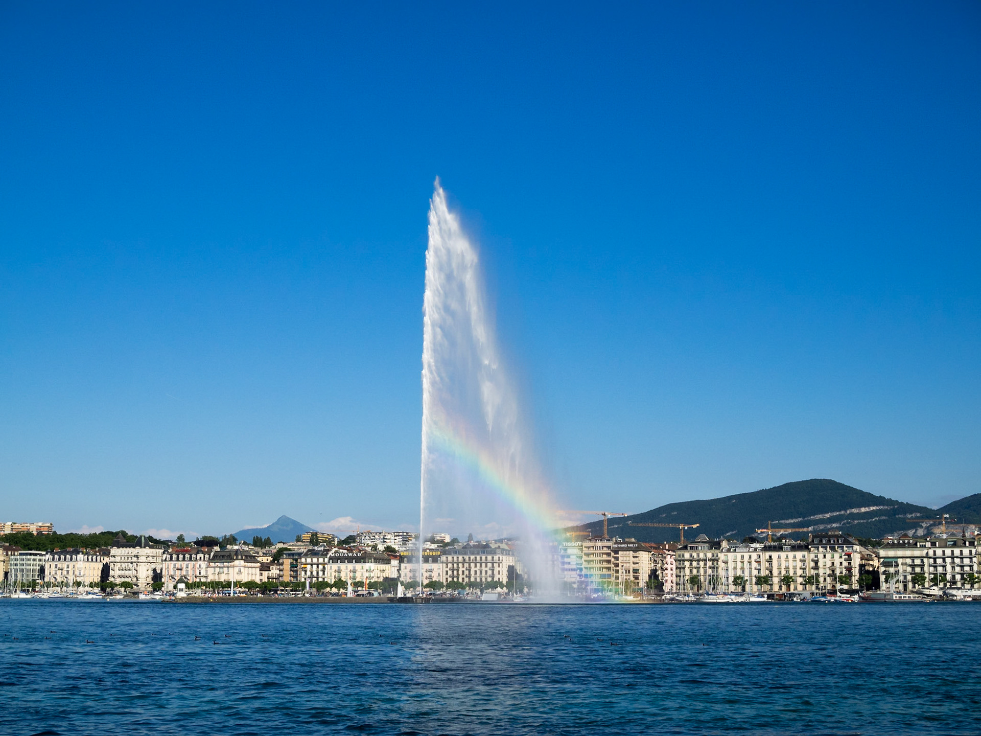 Rainbow by the water jet on lake Geneva
