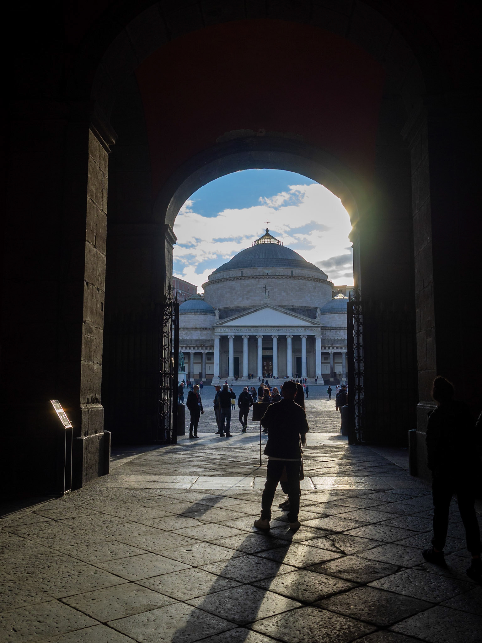 San Francesco di Paola Church seen under an arch of Naples Royal Palace