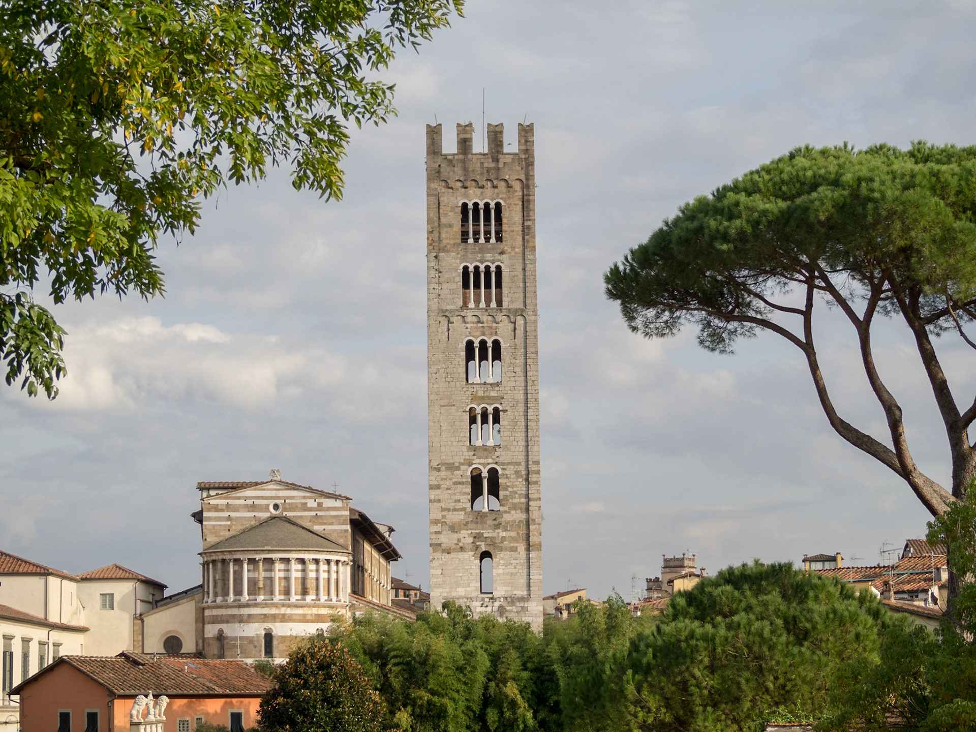 San Frediano Basilica clock tower over Lucca rooftops