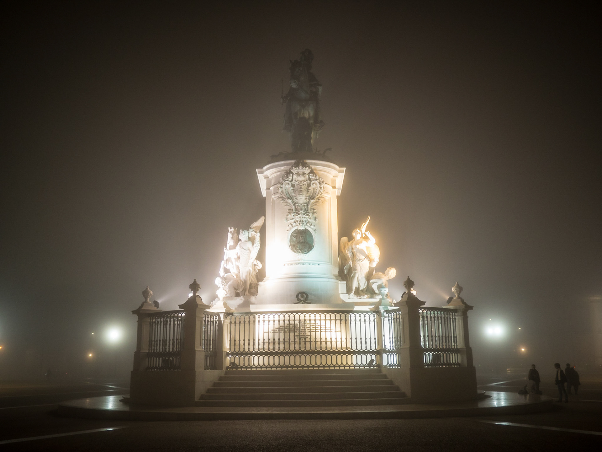 Dom Jose equestrian statue in Comercio Square in a foggy night, Lisbon