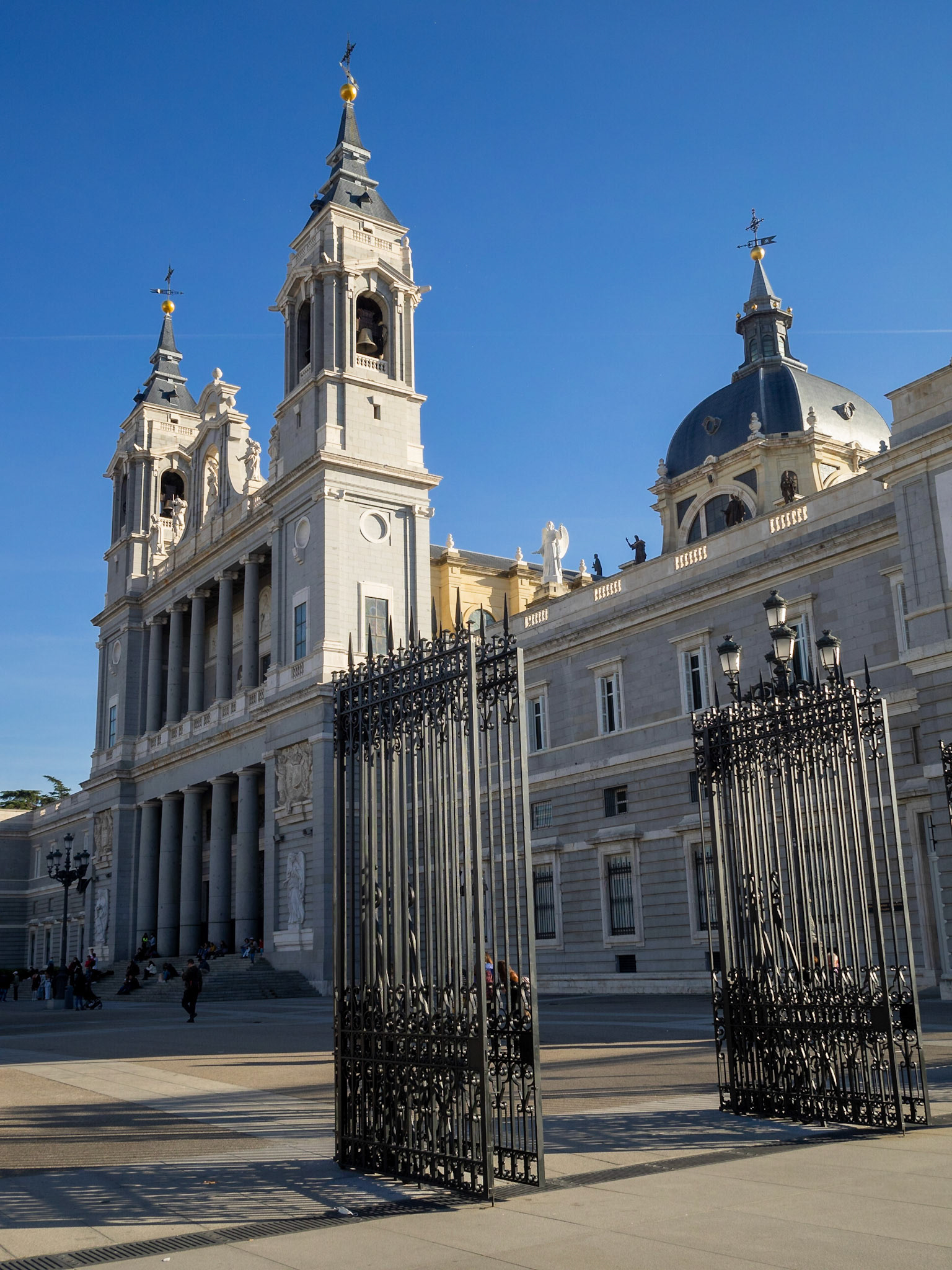 Almude Cathedral facacde seen behind the gates of the Mirador de la Cornisa, Madrid