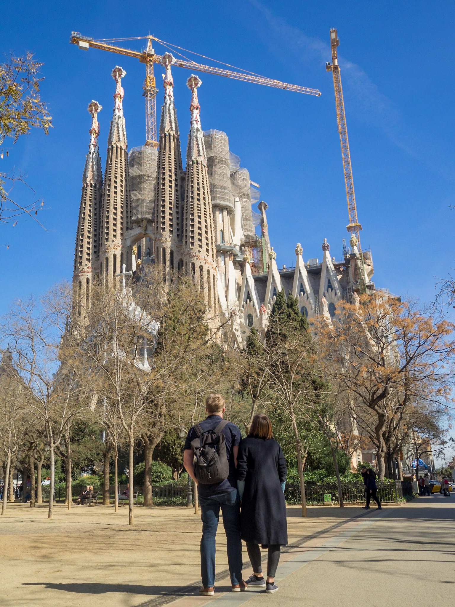 A couple looks at Sagrada Familia Basilica